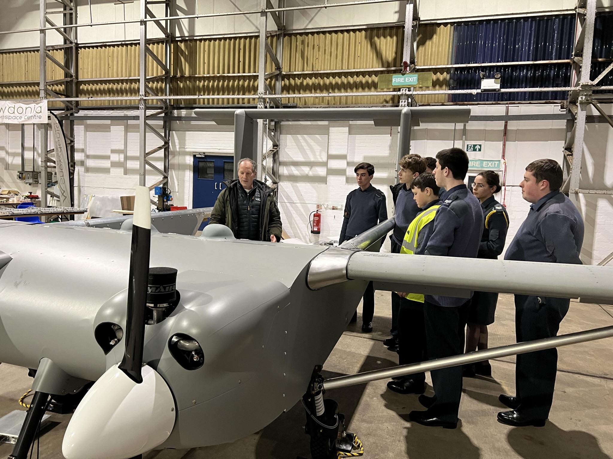 A group of Air Cadets and Volunteers stood around a UAV