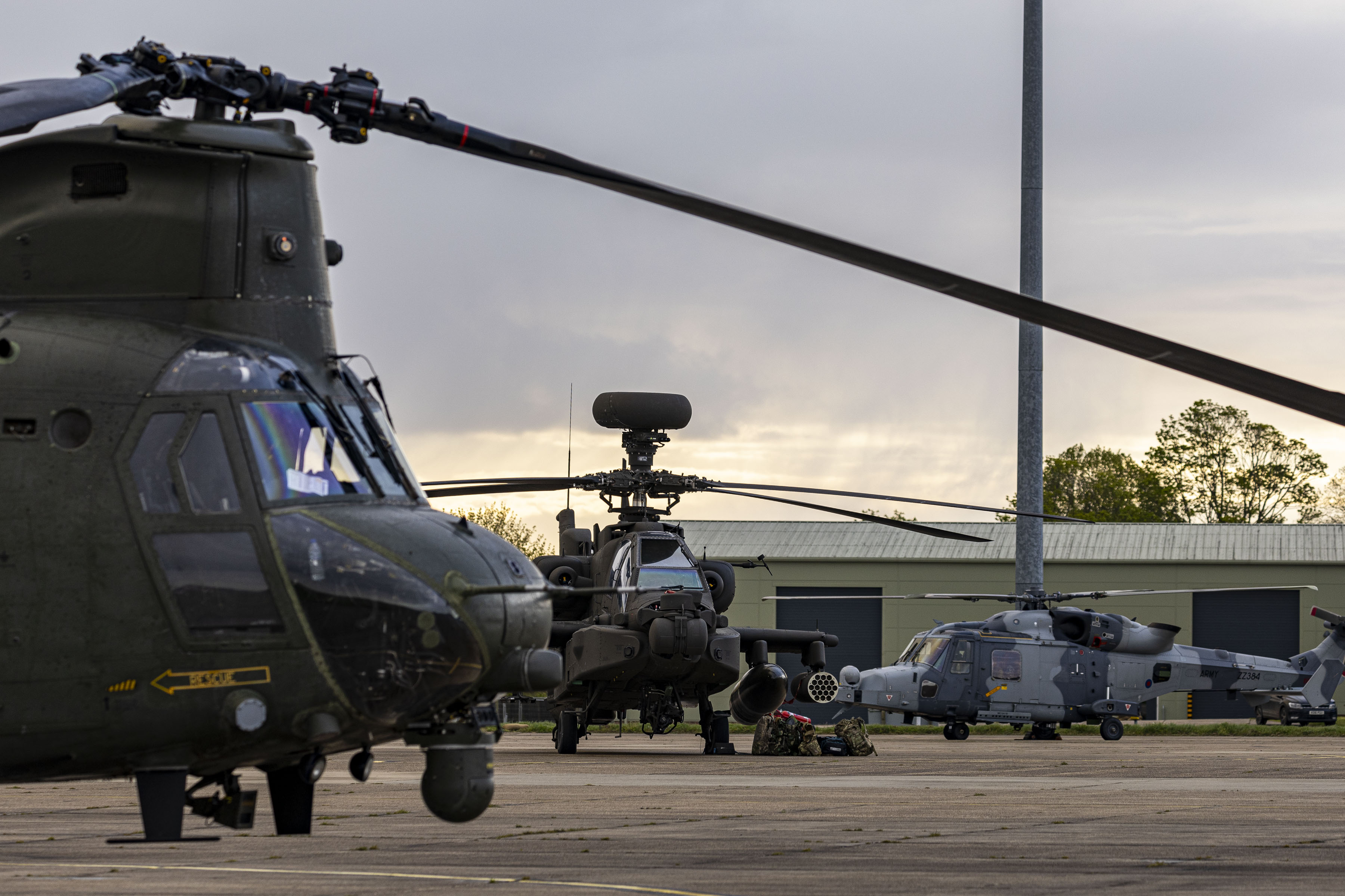Image shows Chinook, Apache and Wildcat helicopters.