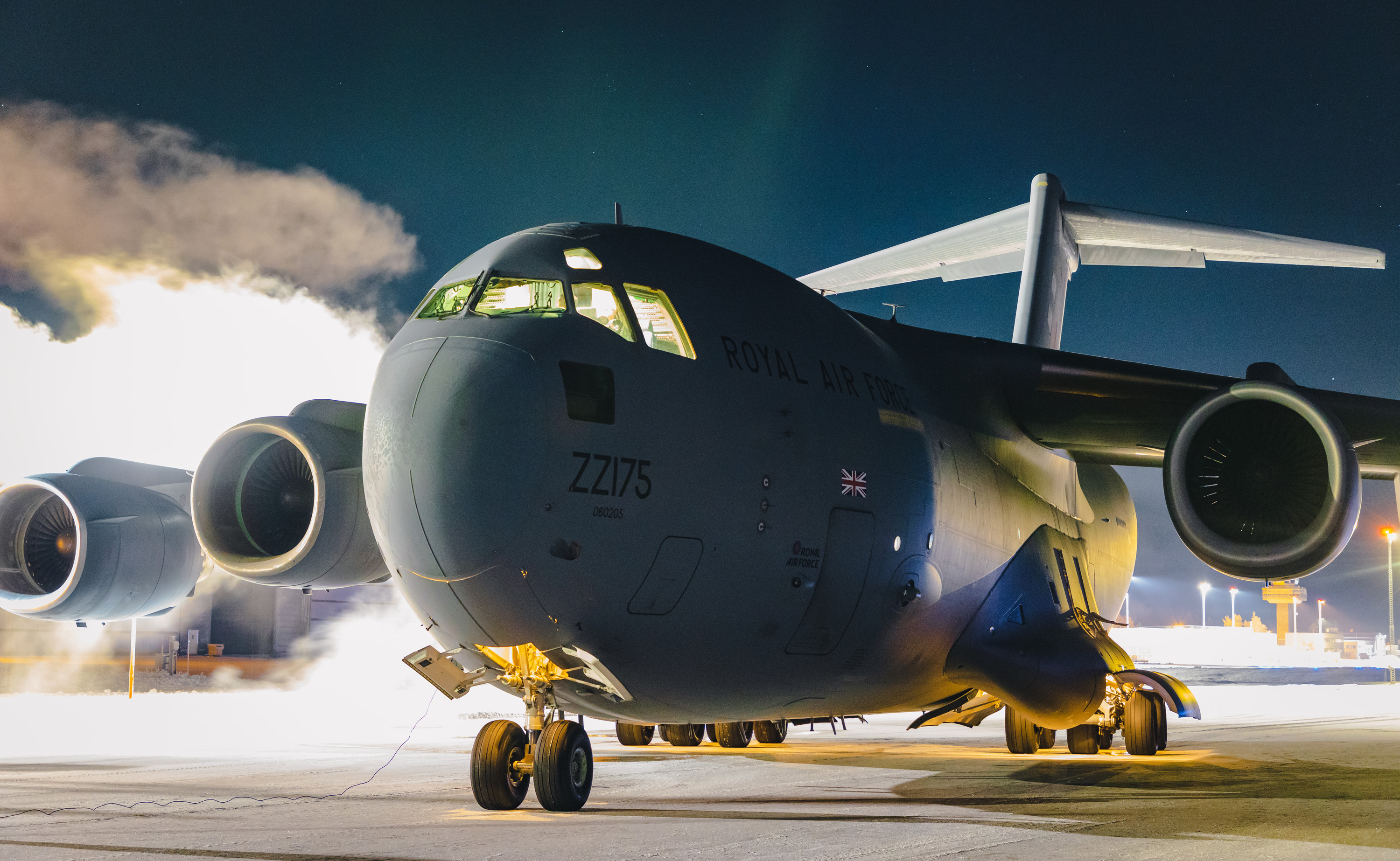Image shows RAF Globemaster on the airfield at night.