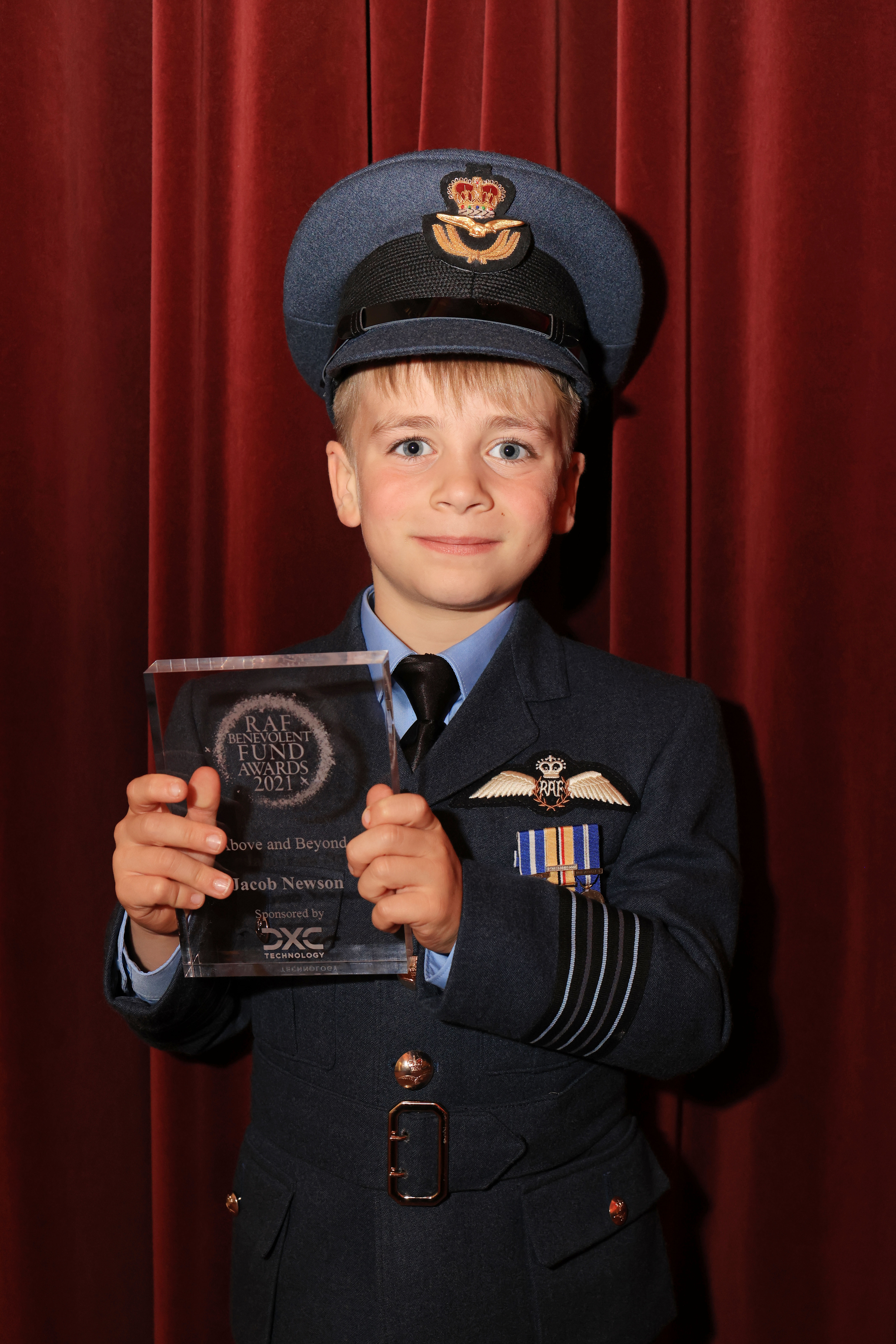 Jacob holds his award.