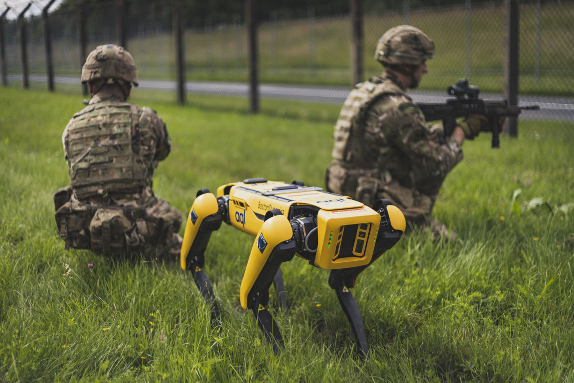 Personnel in the field with Spot the robot dog.