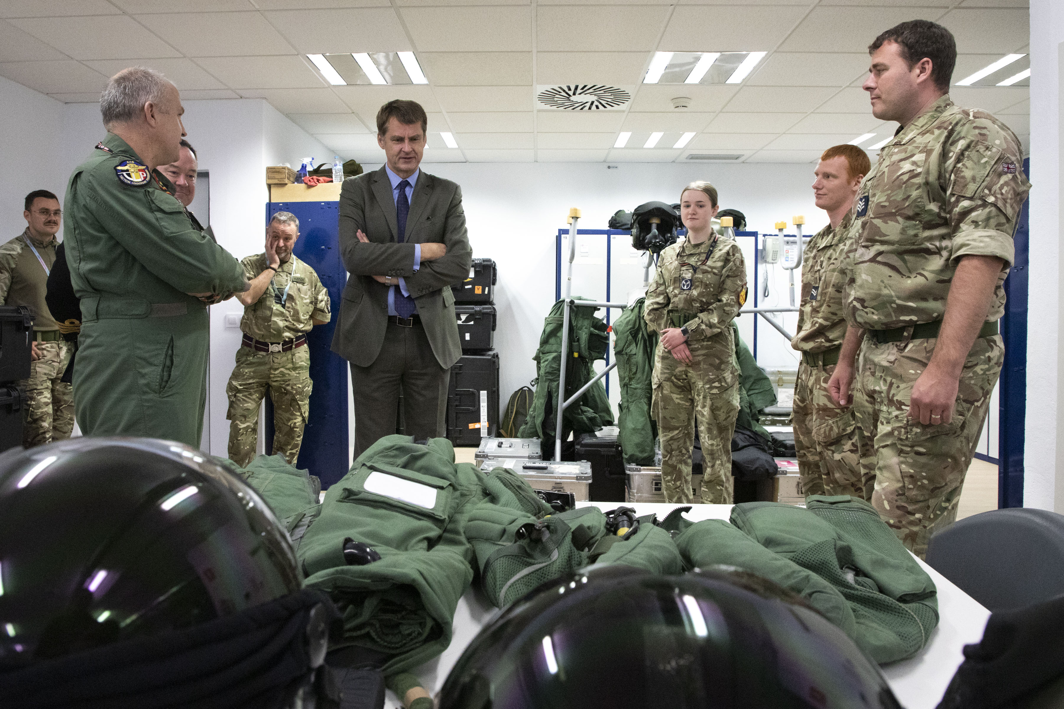 military personnel discussing equipment