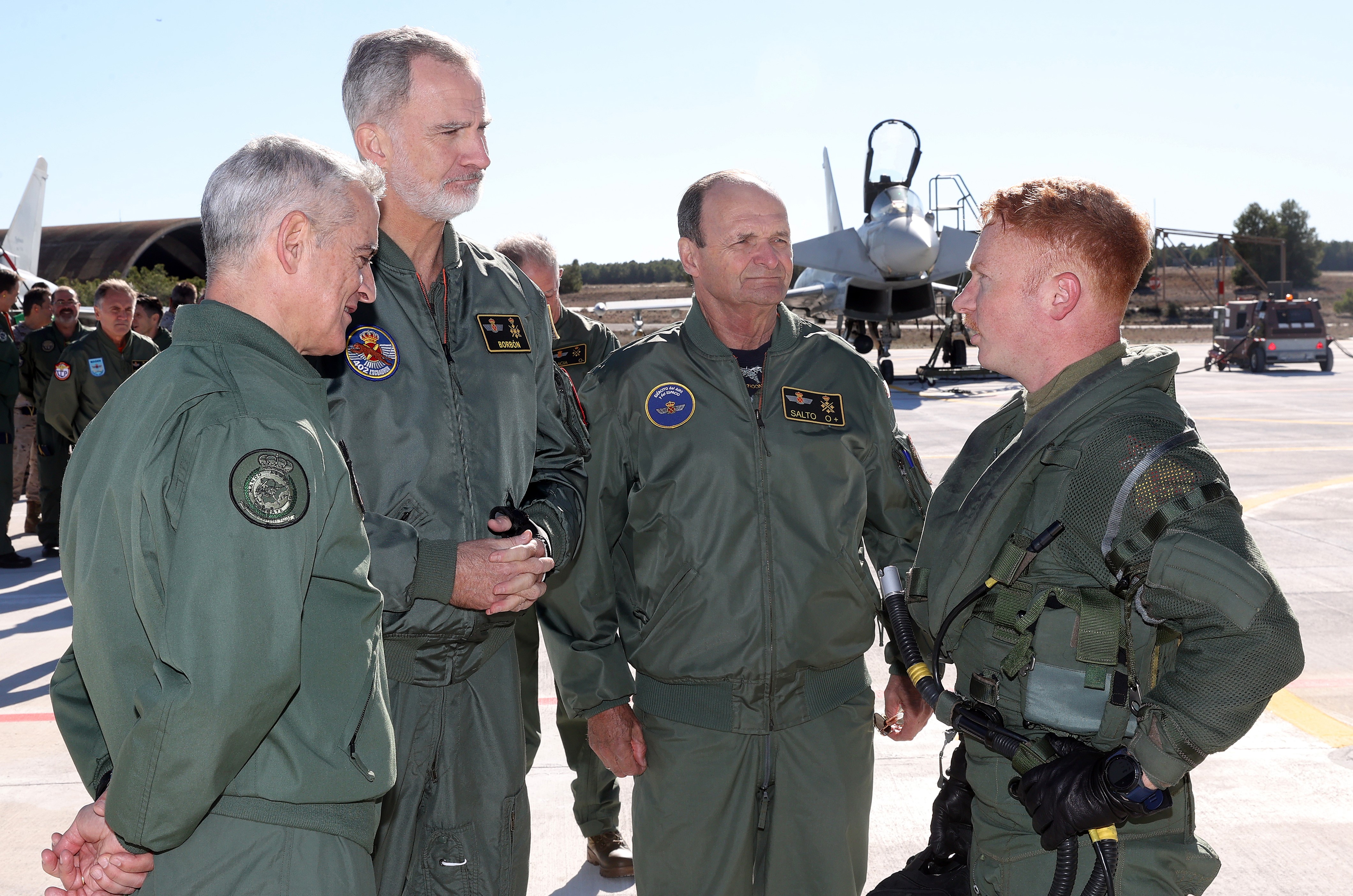 Military pilots talking in front of Typhoon aircraft