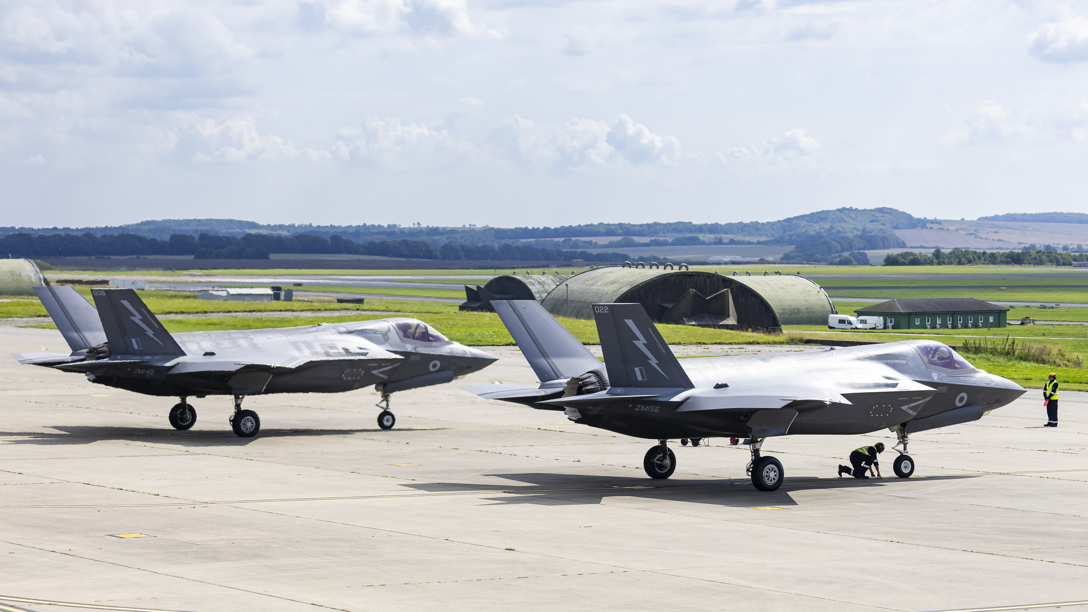 Image shows two RAF F-35 Lightning aircraft on the ground.