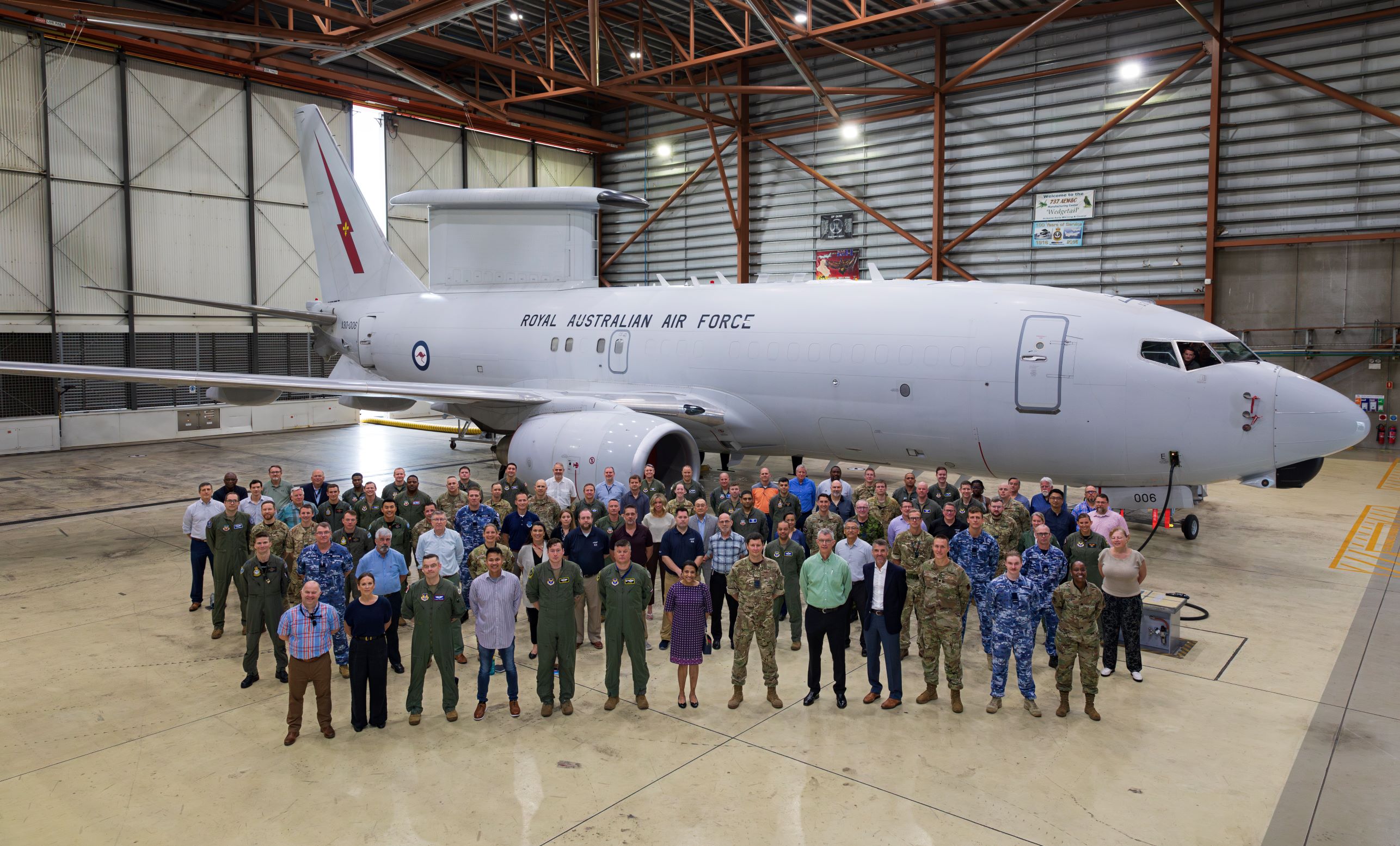 Large group standing in front of RAAF Wedgetail