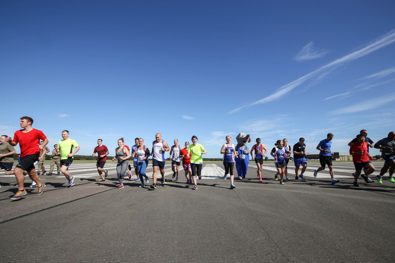The runners set off along the runway.