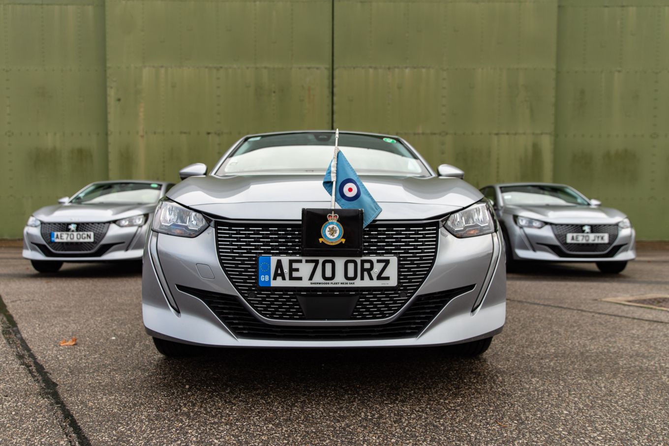 Image shows a close up of the front of one of the new Peugeot e-208 electric vehicles.