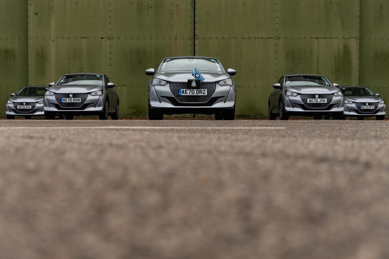 Image shows the five new Peugeot e-208 electric vehicles at RAF Wittering.