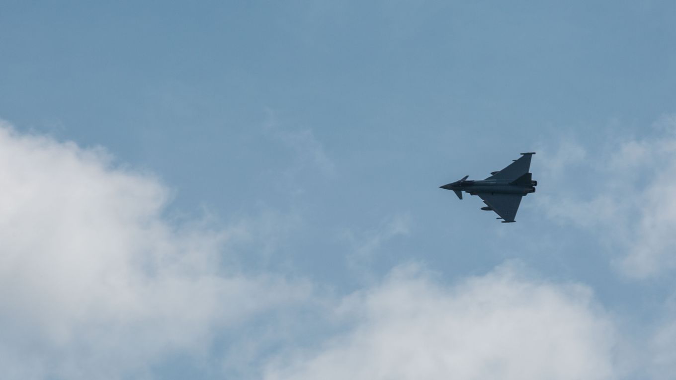 Image shows German Air Force Eurofighter flying in the sky.