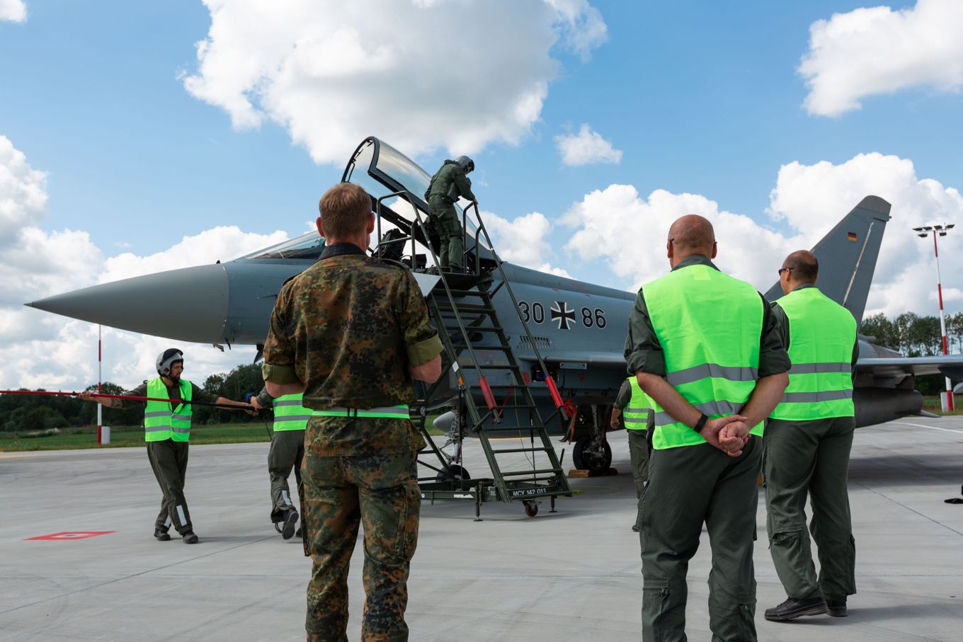 Image shows personnel at the arrival of German Air Force Eurofighters.