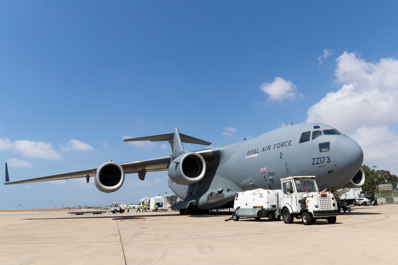 Image shows an RAF C-17 being unloaded.