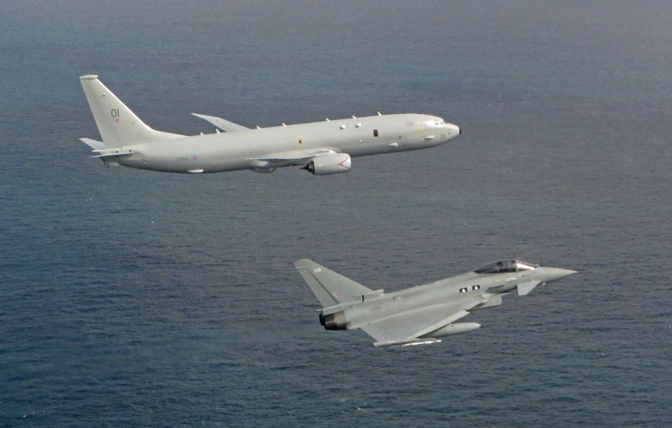 Image shows RAF Poseidon and Typhoon aircraft flying above the North Sea