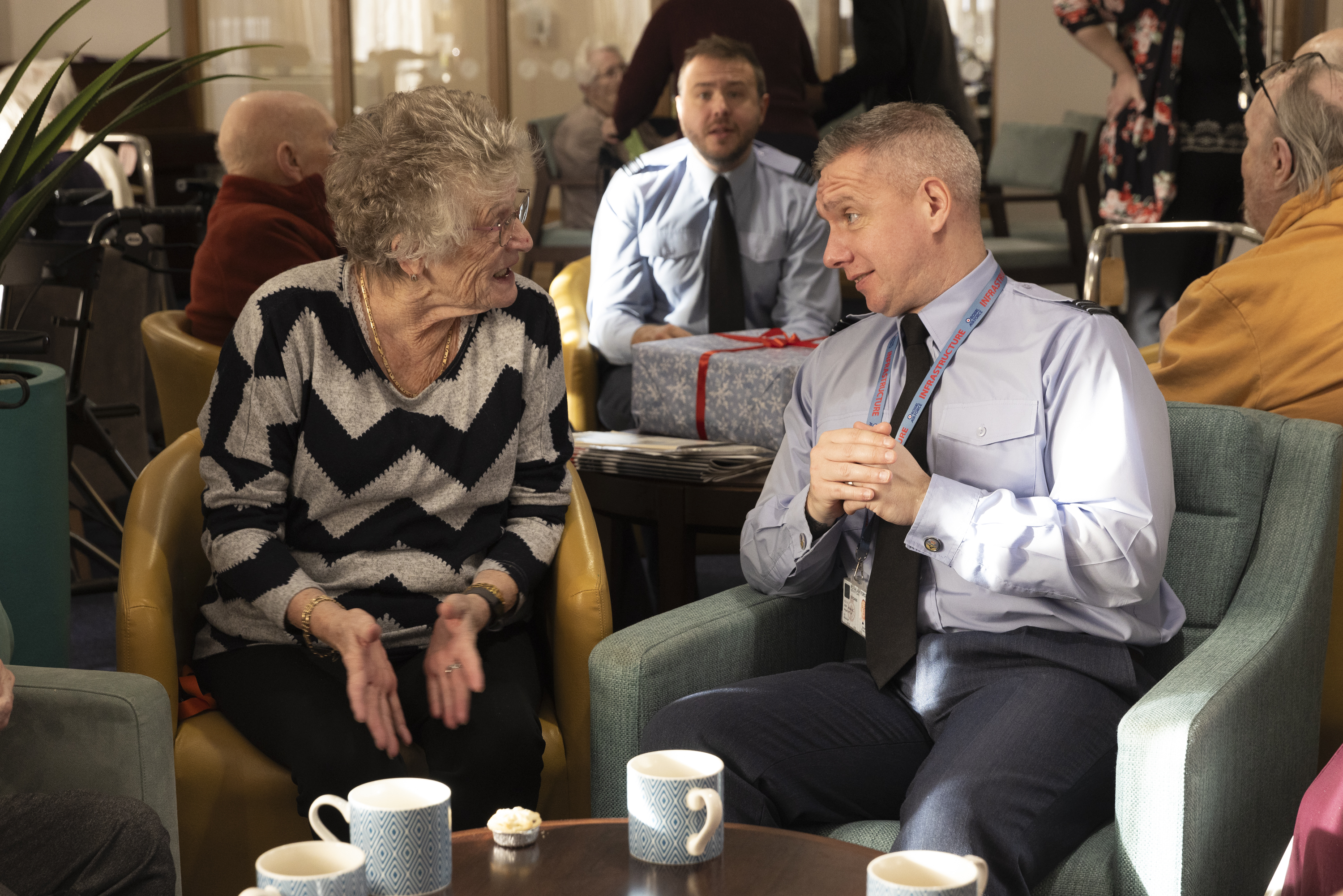 Flt Lt Dean McAulay chats with residents of Kingfisher Court in Peterborough