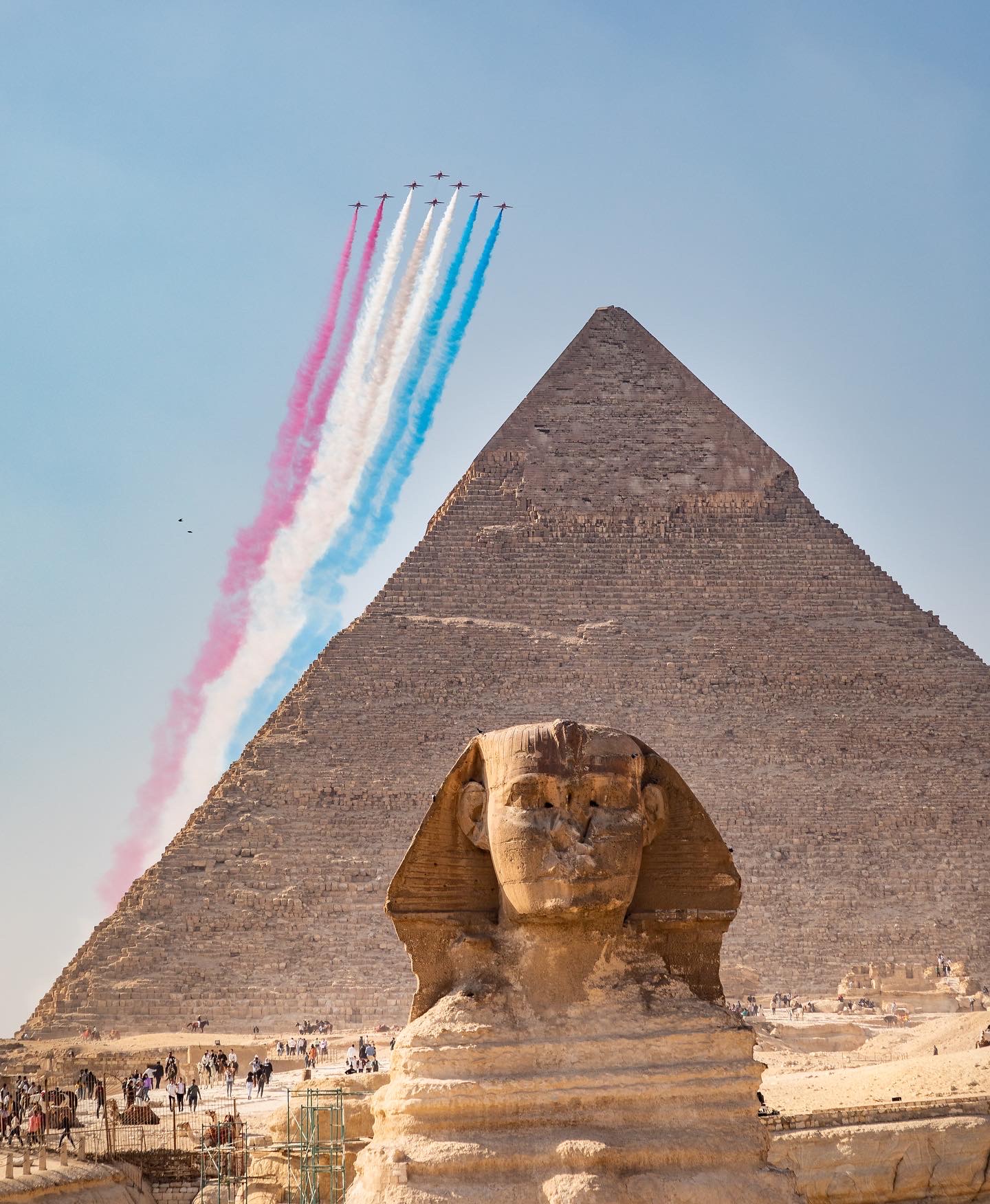 The Red Arrows over the Pyramids n Egypt.