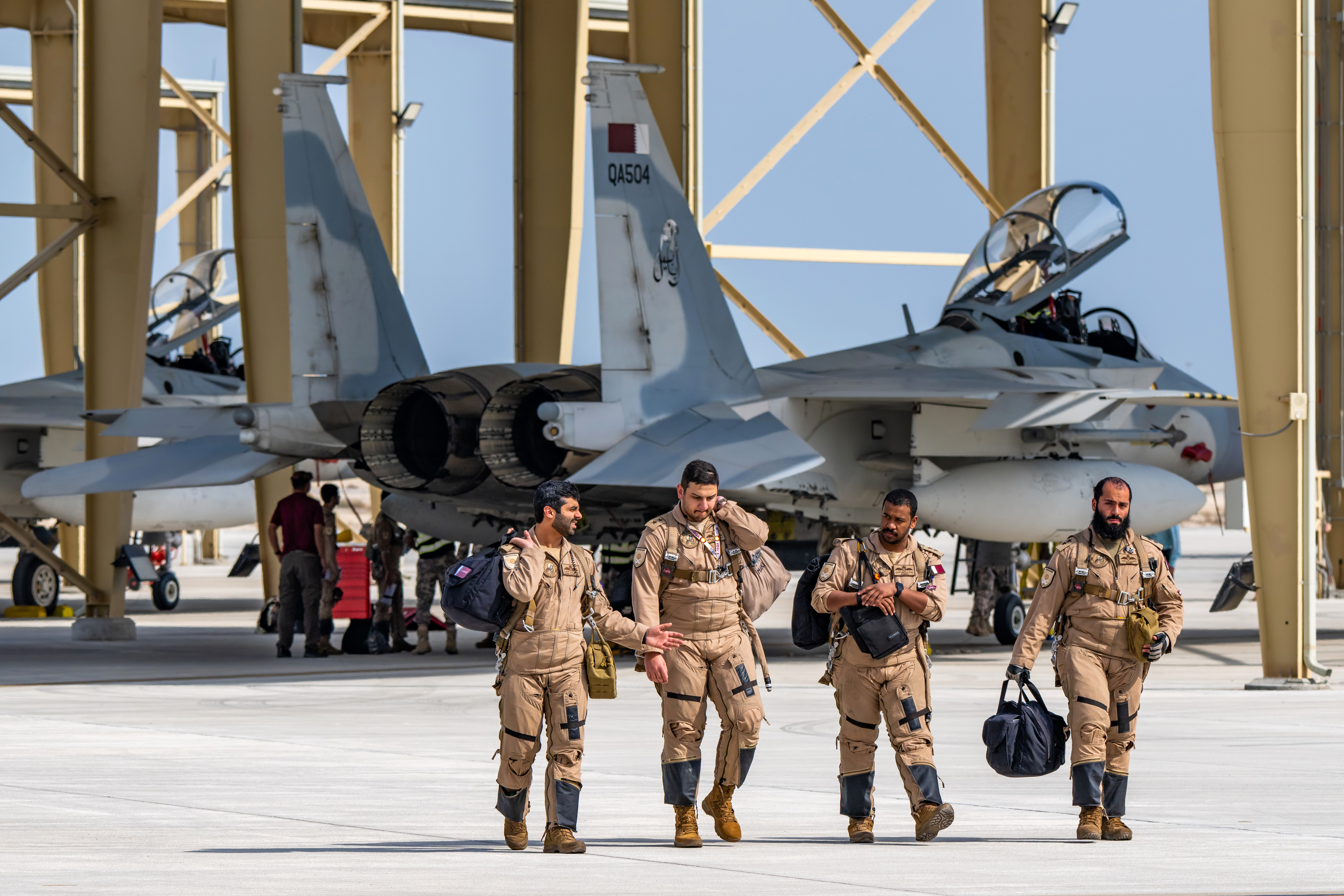 Qatari aircrew walk in after a sortie