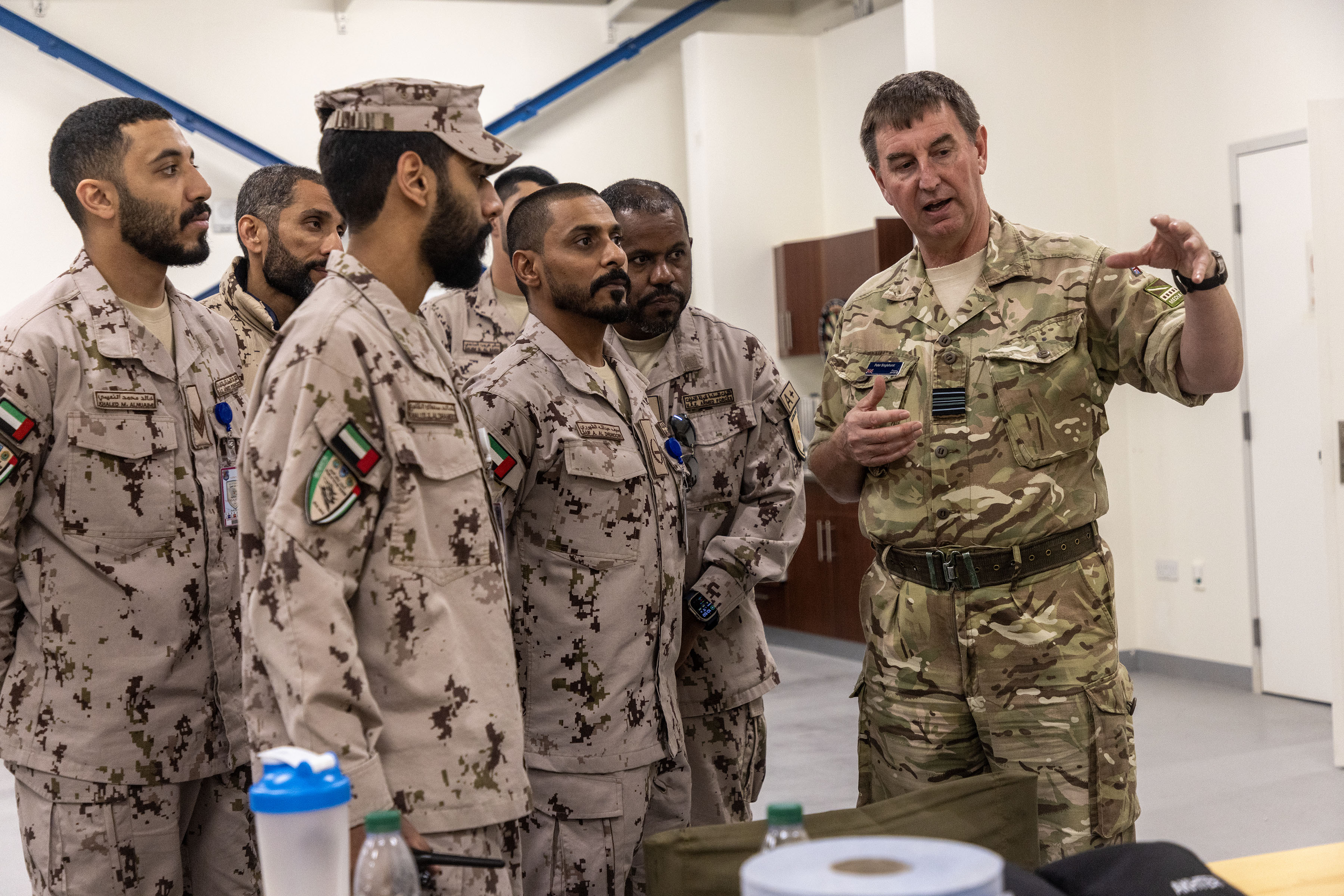 RAF serviceperson speaking to a group of UAE personnel