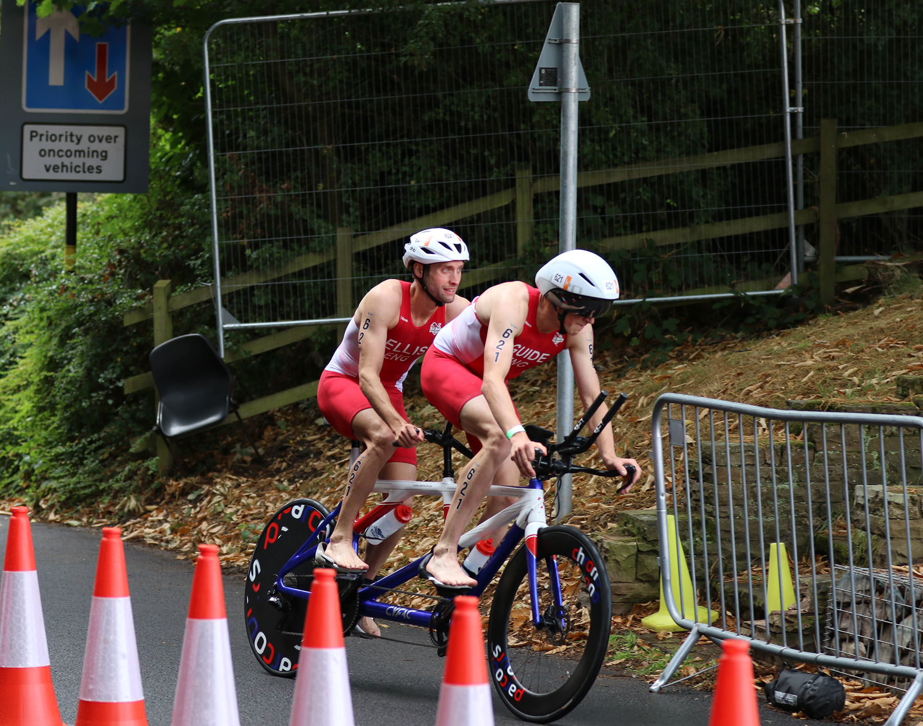 Image shows cyclists and traffic cones going around a corner.