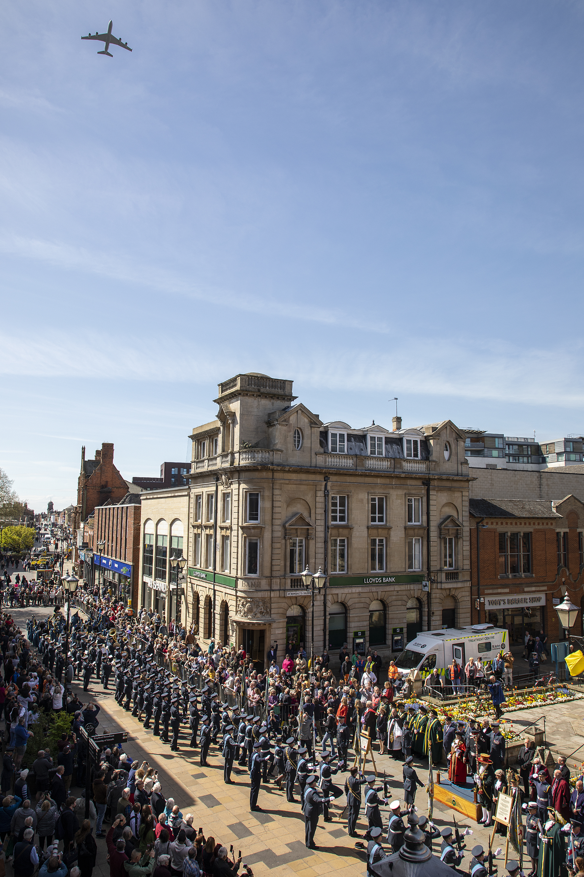 Flypast over parade through the streets.