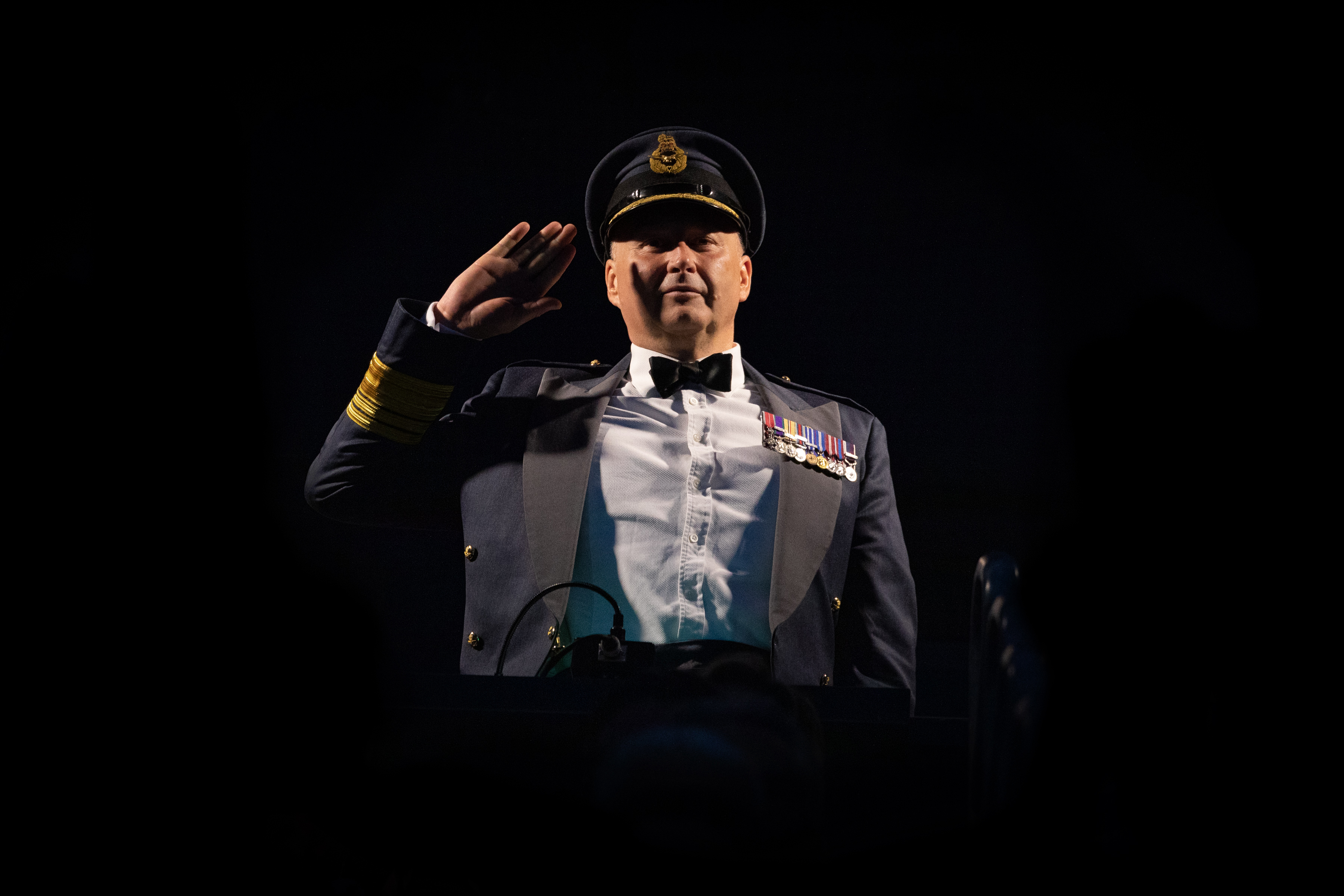Image shows RAF aviator saluting.