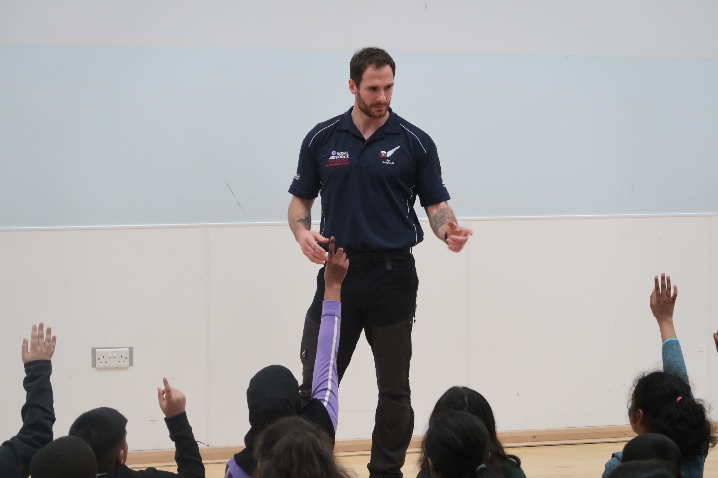 Members of the Royal Air Force Falcons Parachute Display Team have visited a primary school in the West Midlands during a break in their display training.