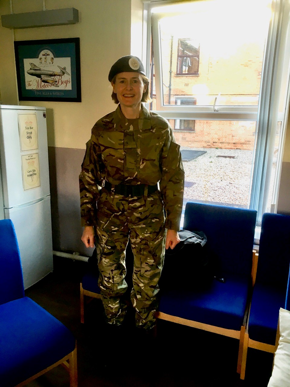 Ana in uniform in the break room.