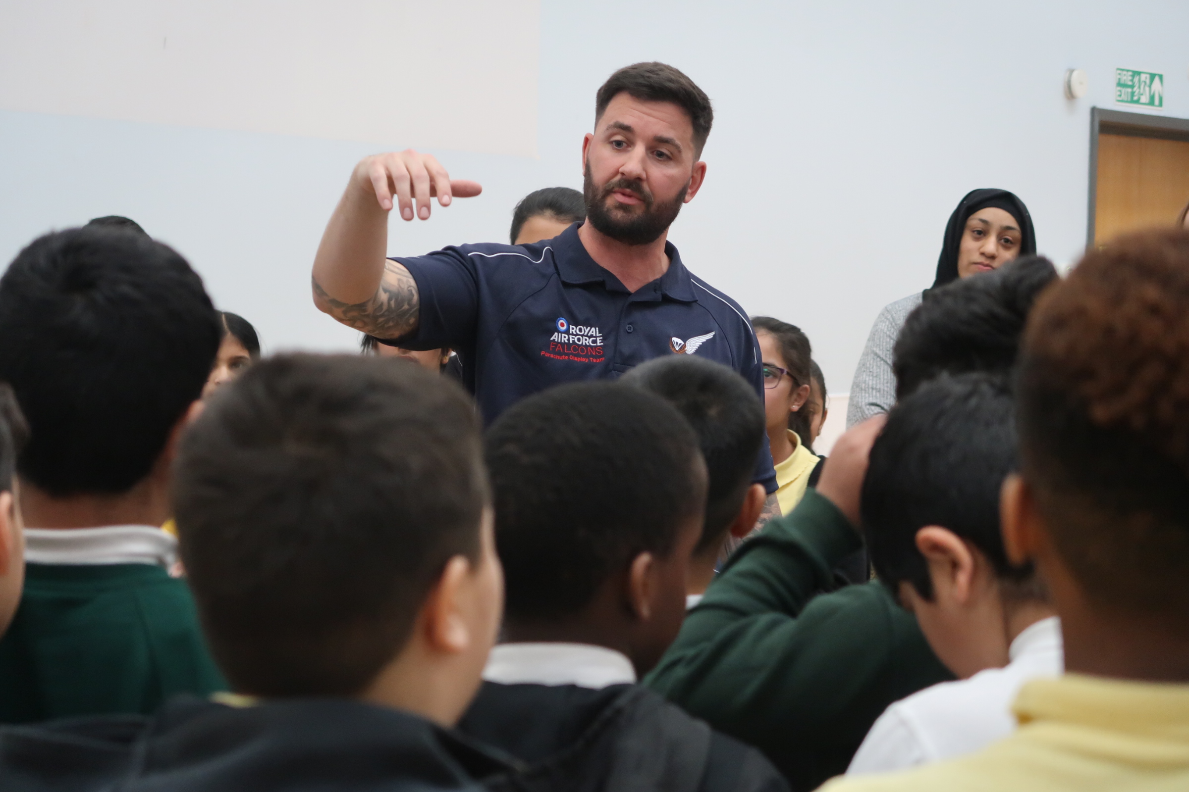 Members of the Royal Air Force Falcons Parachute Display Team have visited a primary school in the West Midlands during a break in their display training.