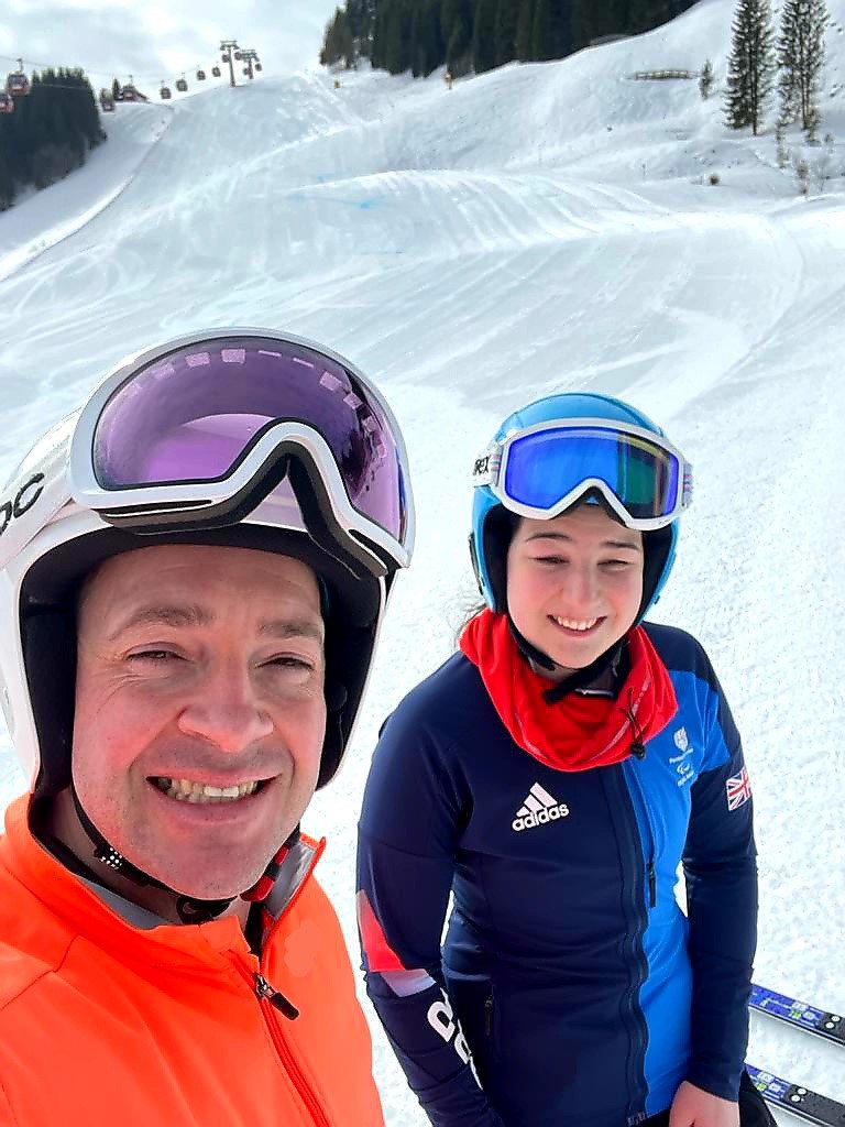 Selfie on the slopes while in skiing gear.
