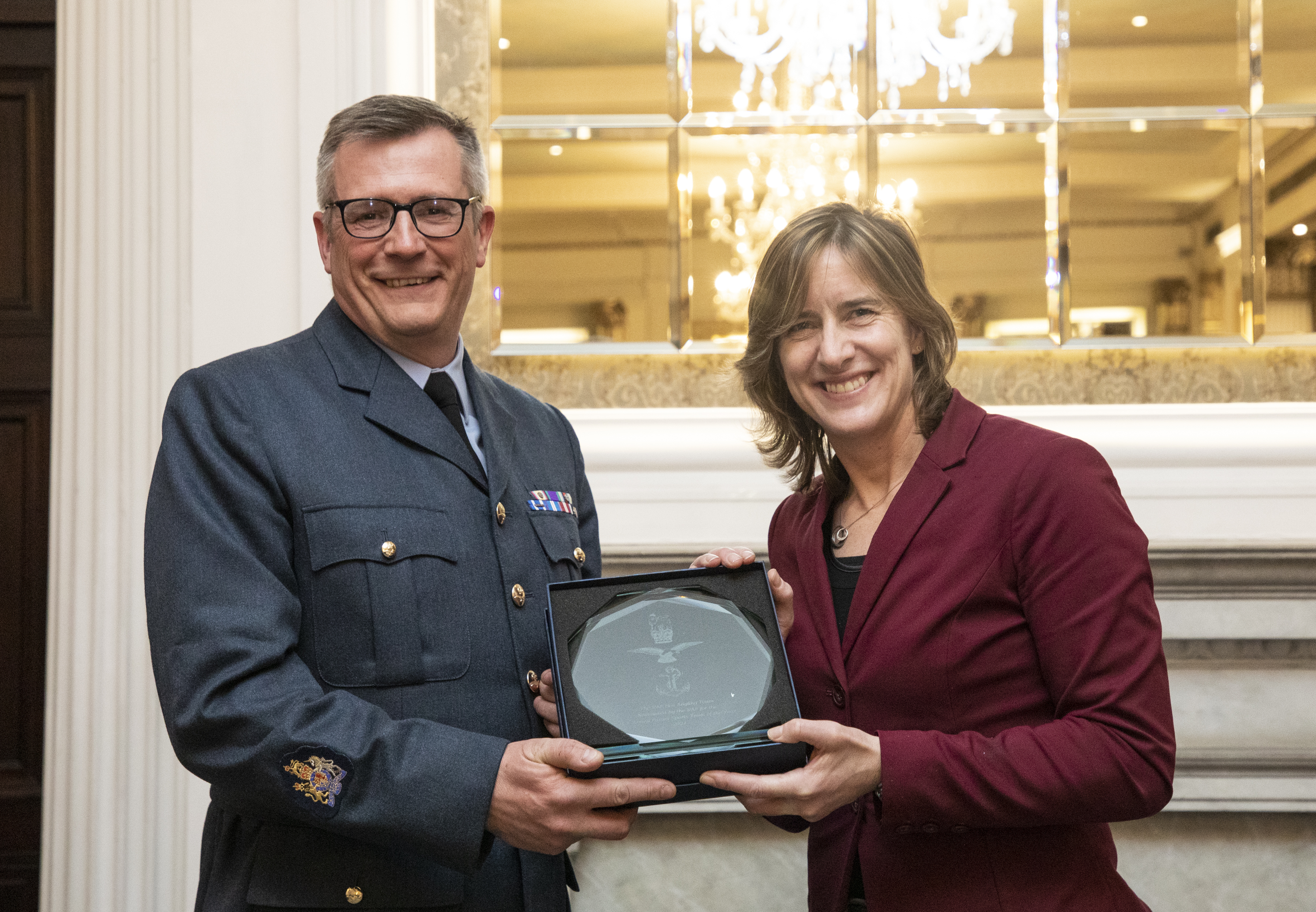 Caroline presents Daz with his award.