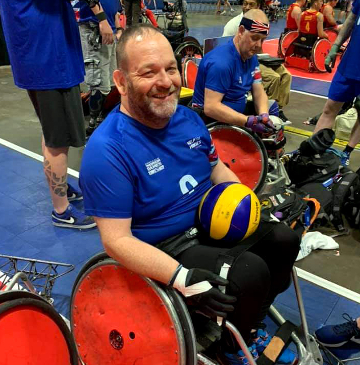 Personnel sits in a wheelchair.