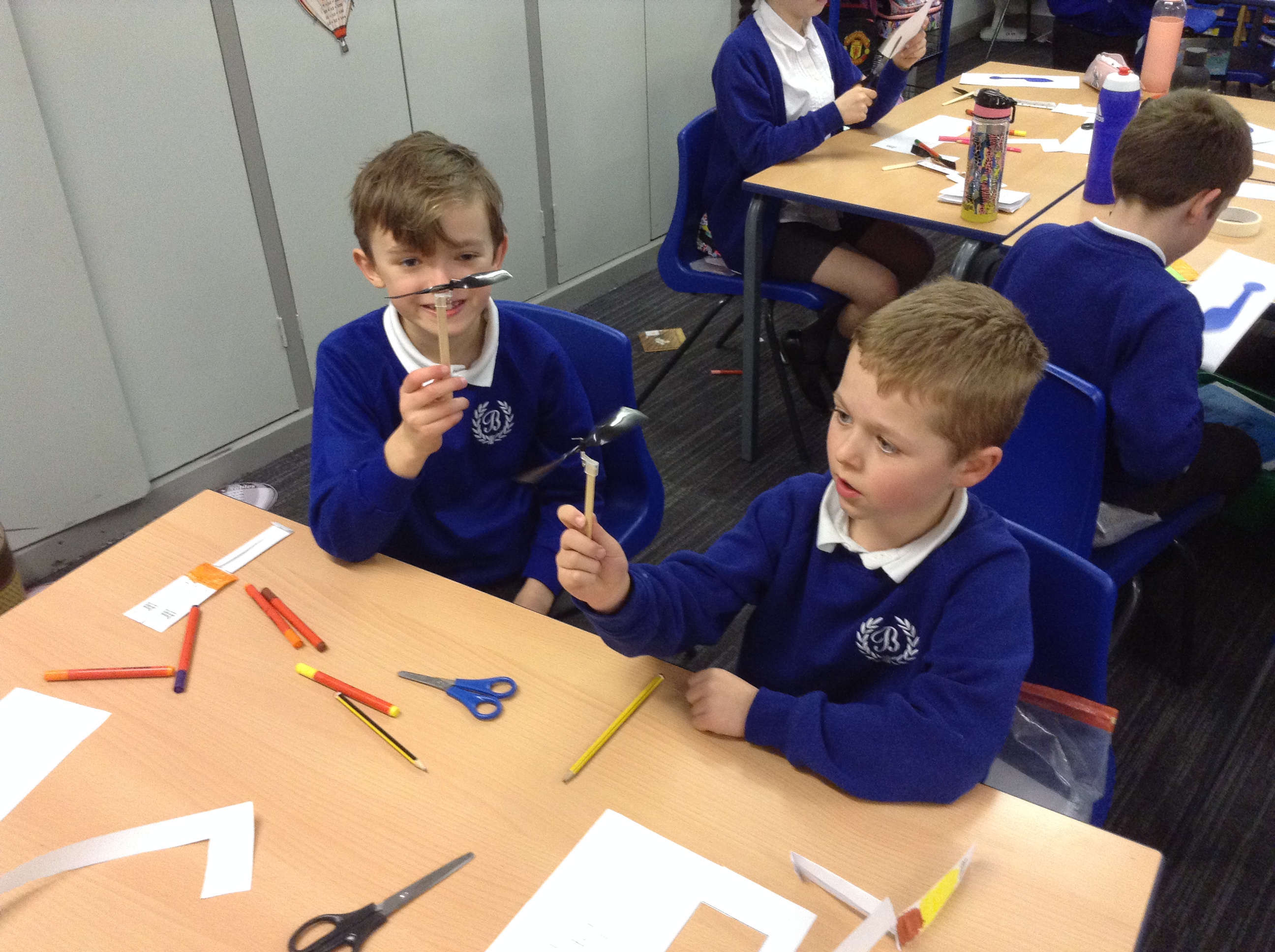 School children work on miniatures in the classroom.