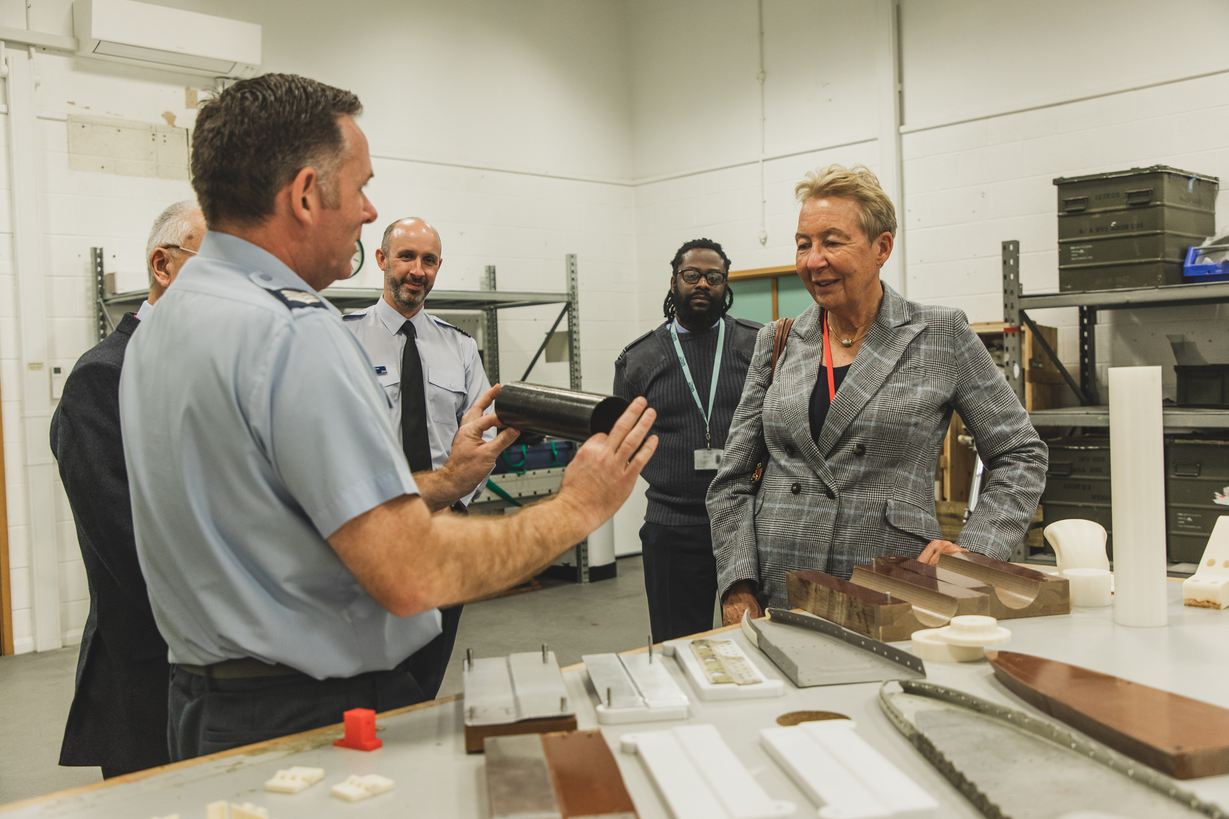 Sgt Michael Matthias of No 71 Squadron demonstrates the properties of fibre reinforced plastics and 3D printing to the Lord Lieutenant