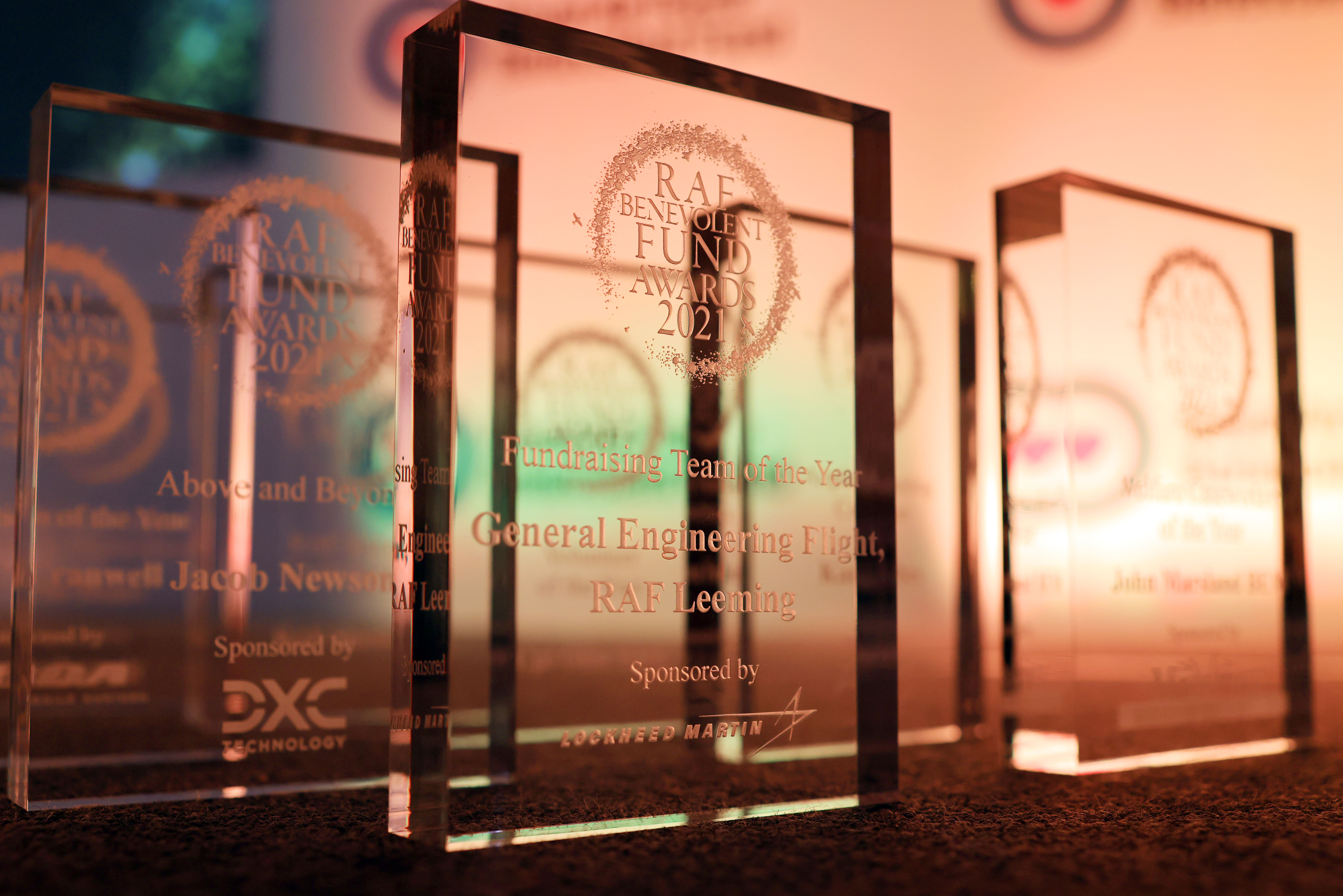 Glass awards set out on the table.