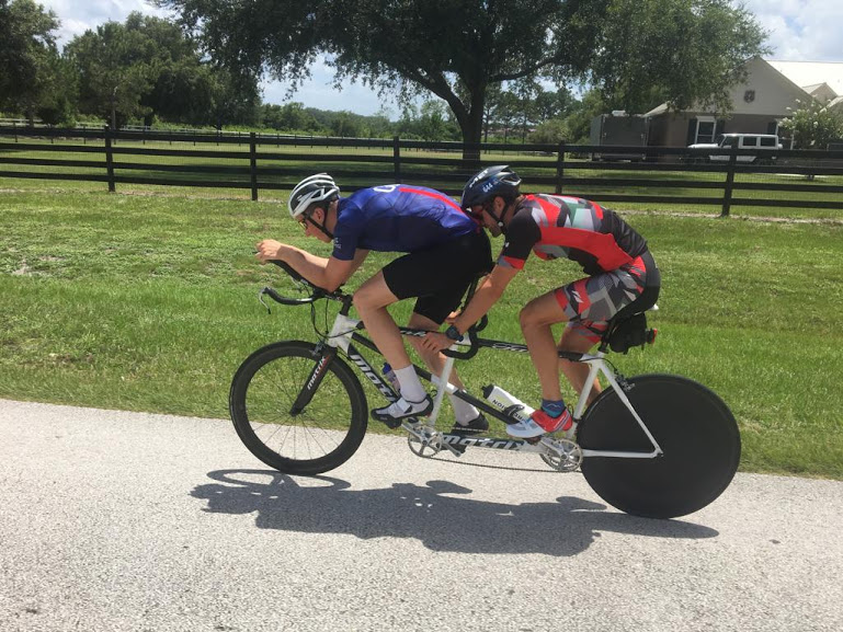 Luke and David on a tandem bike.