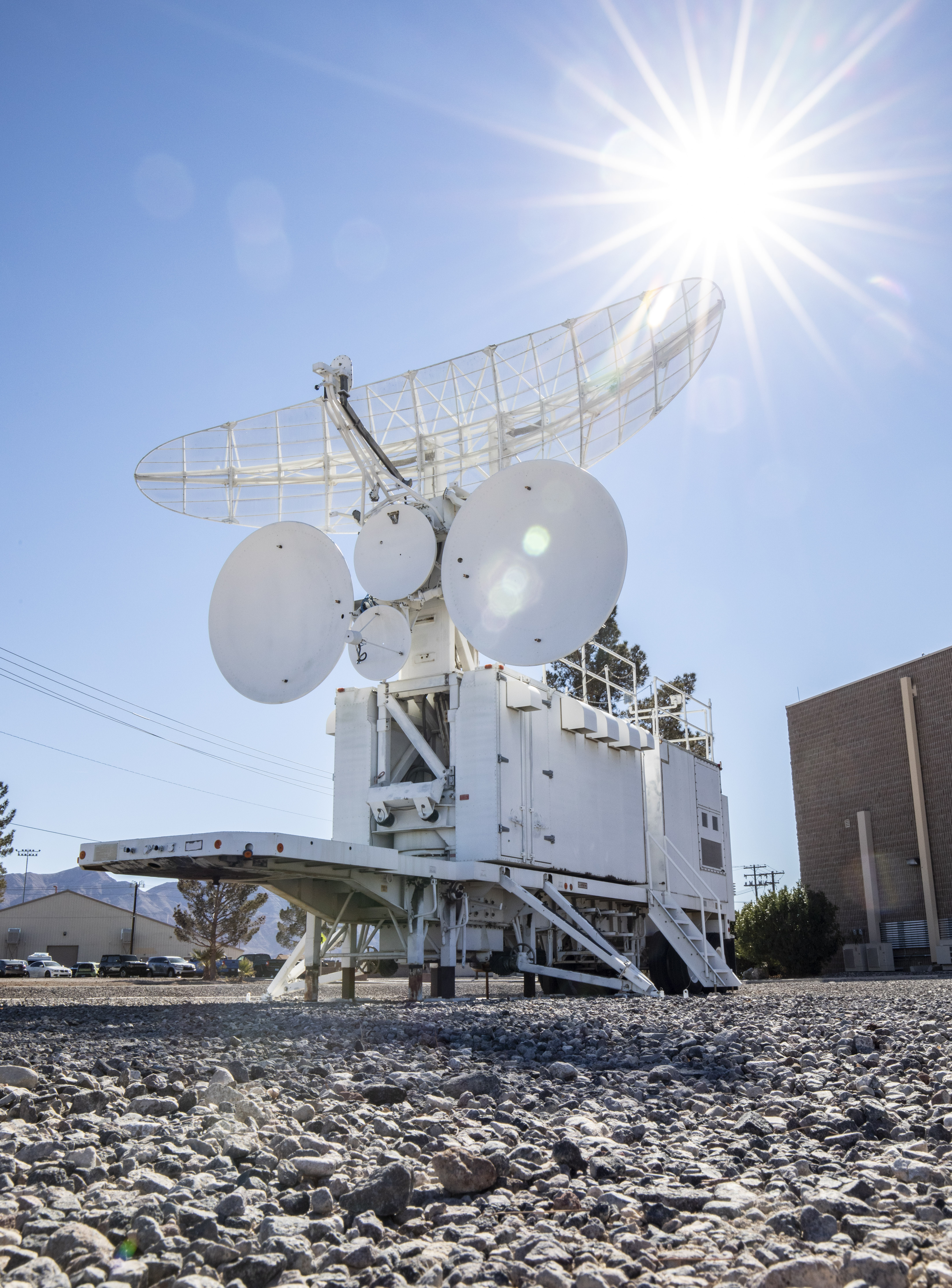Ground satellite with sunlight in the sky.