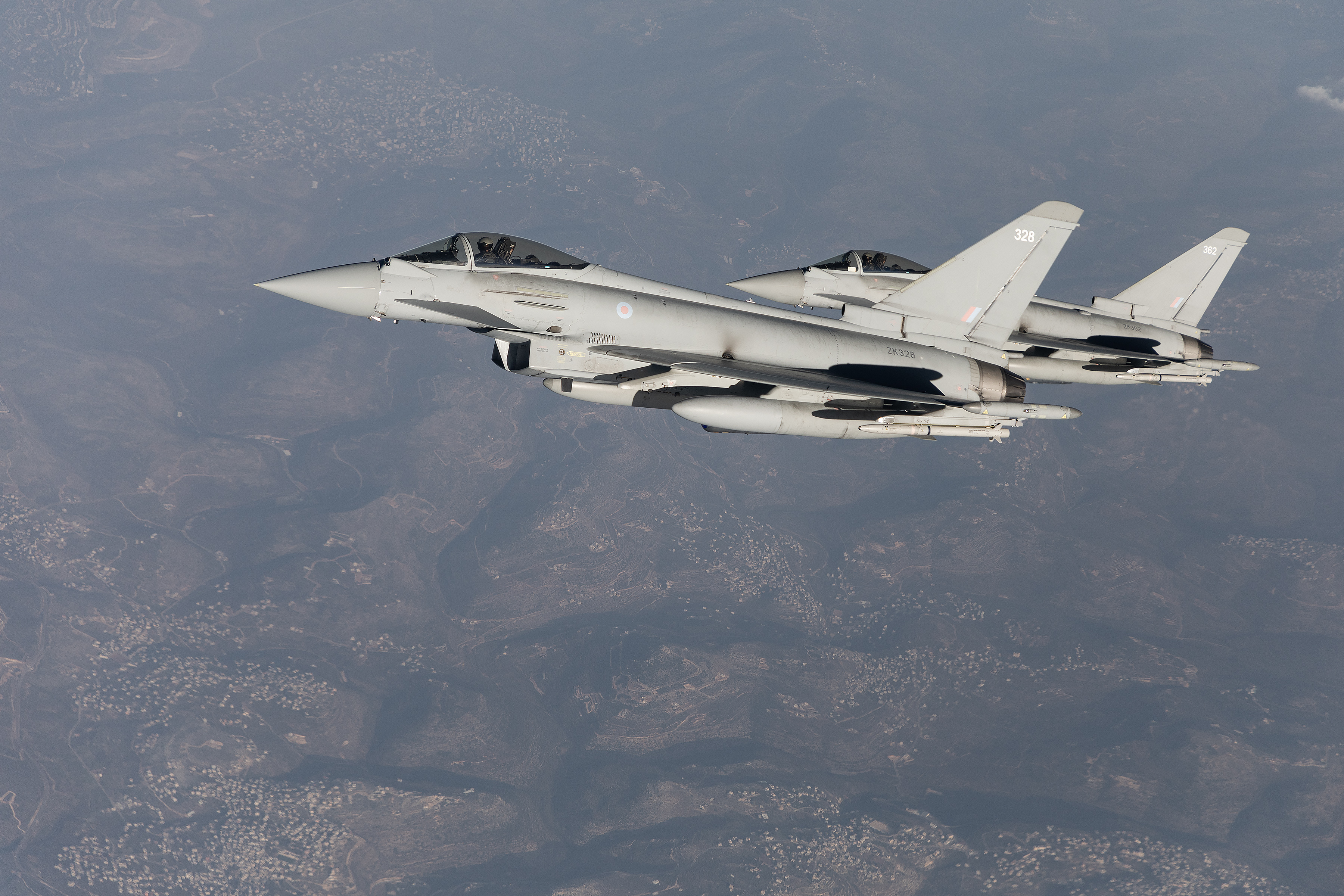Image shows two RAF Typhoons in flight.
