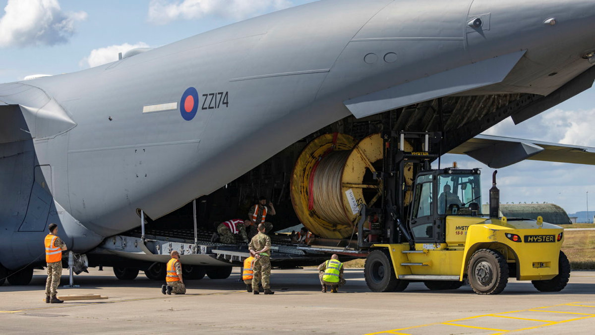 Picture shows RAF aircraft being loaded with equipment.