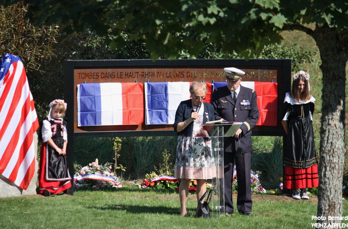 Memorial with speech stand and flags.