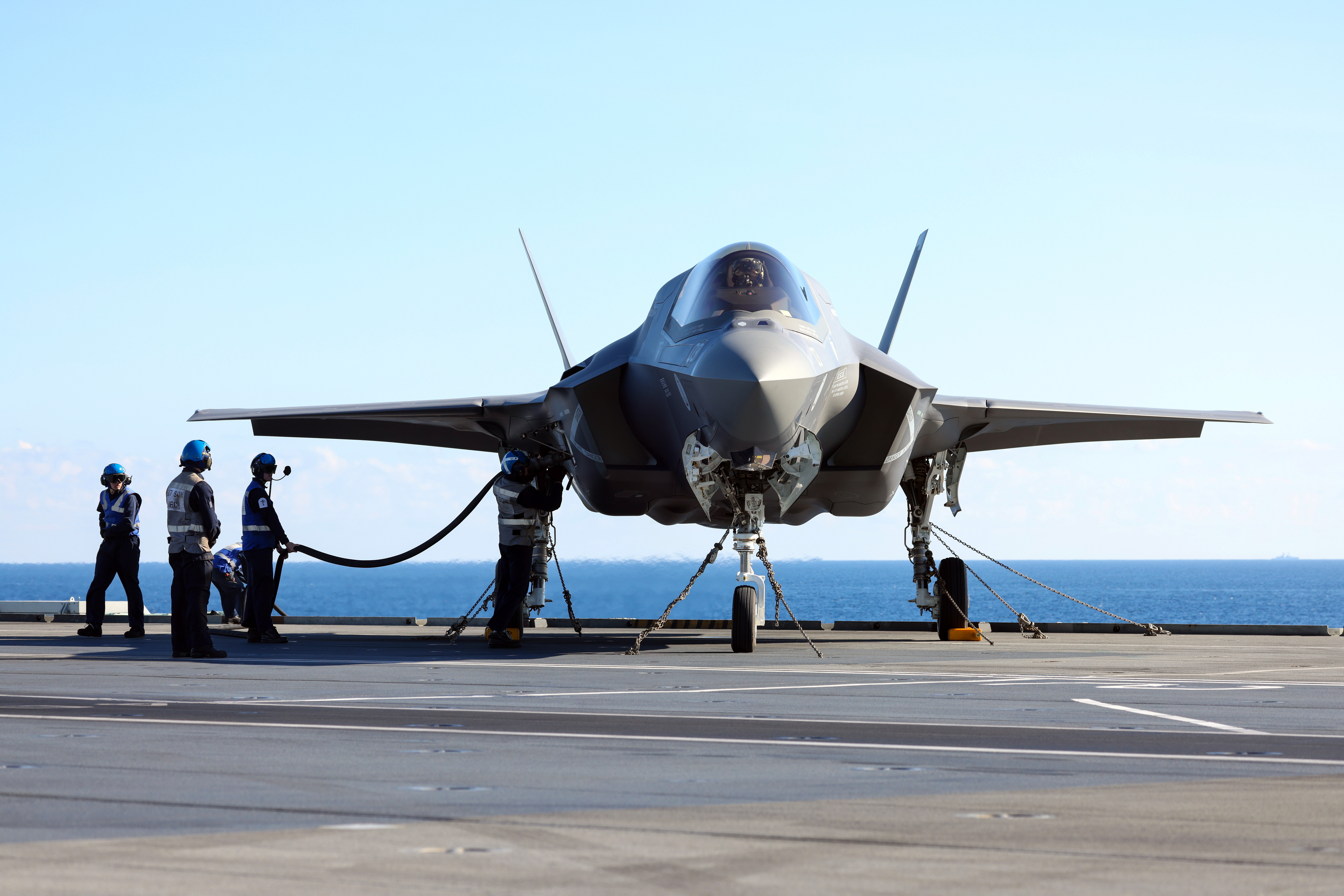 Aircraft being refuelled on the carrier.