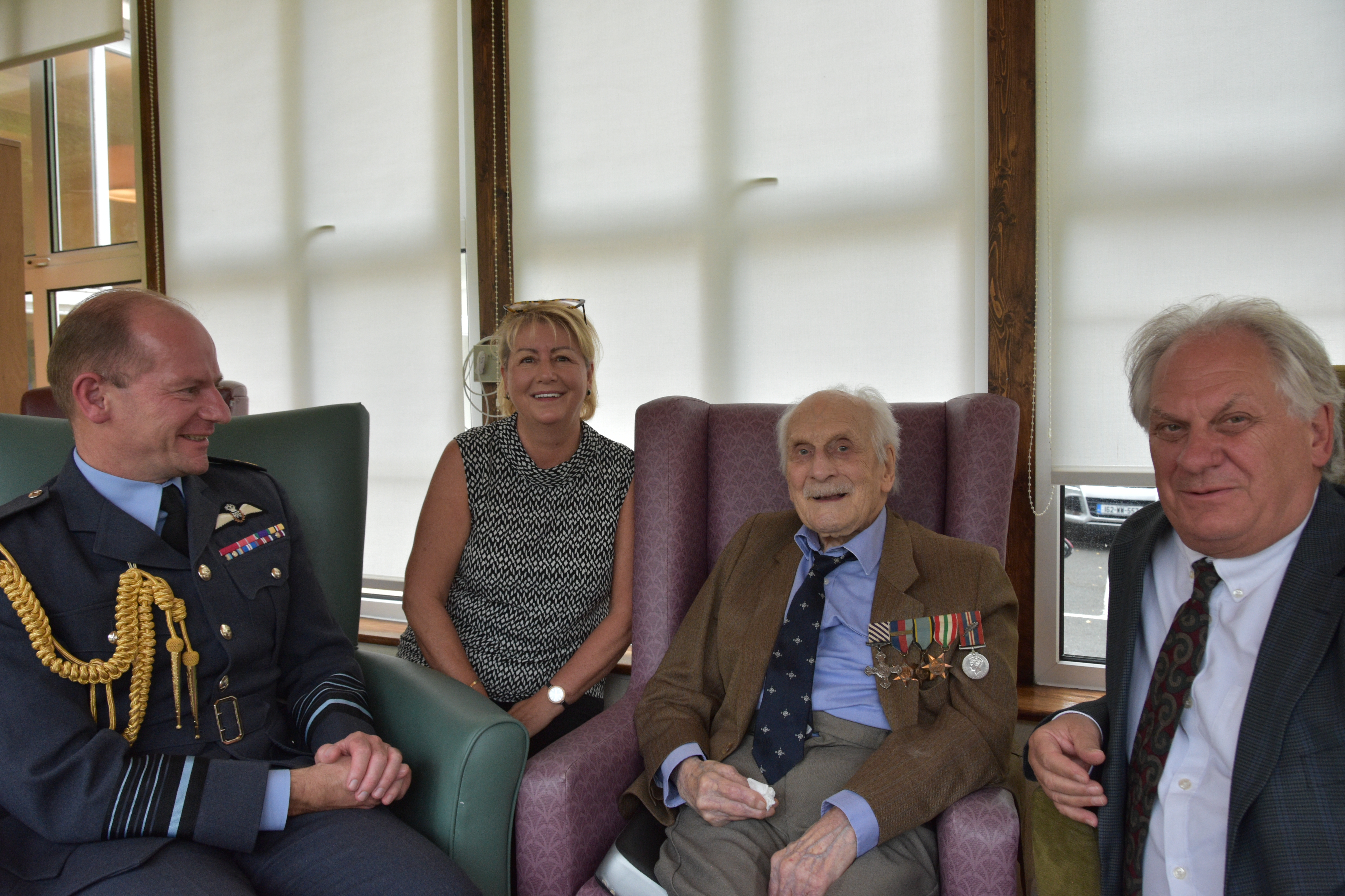 Group Captain (retired) John ‘Paddy’ Hemingway and Air Chief Marshal Sir Mike Wigston with Care Home staff.