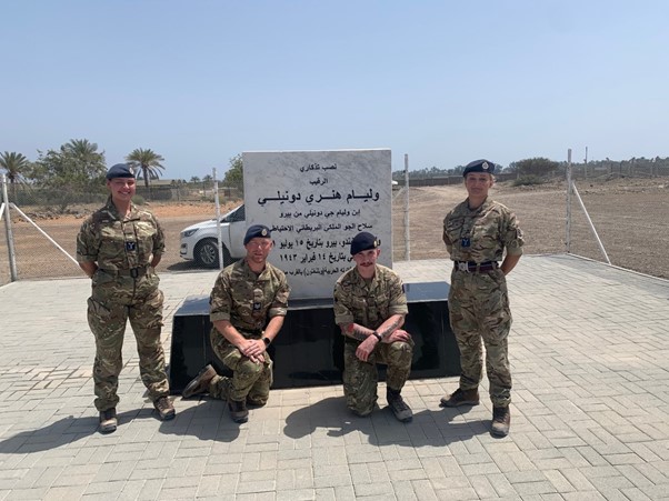 Personnel with memorial.
