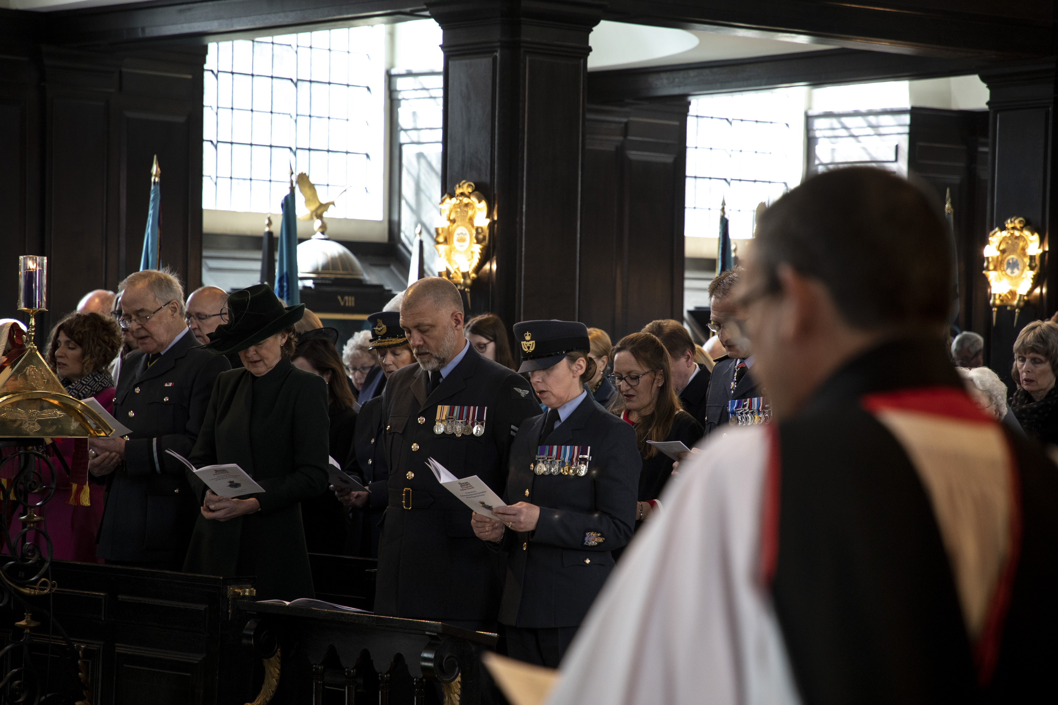 Personnel and attendance join the church reading of hymns.