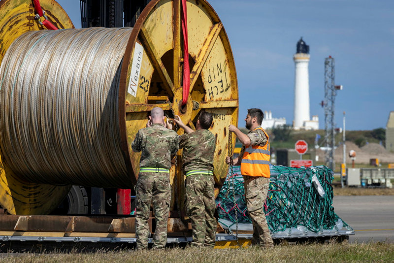 Picture shows a team of RAF personnel preparing equipment.