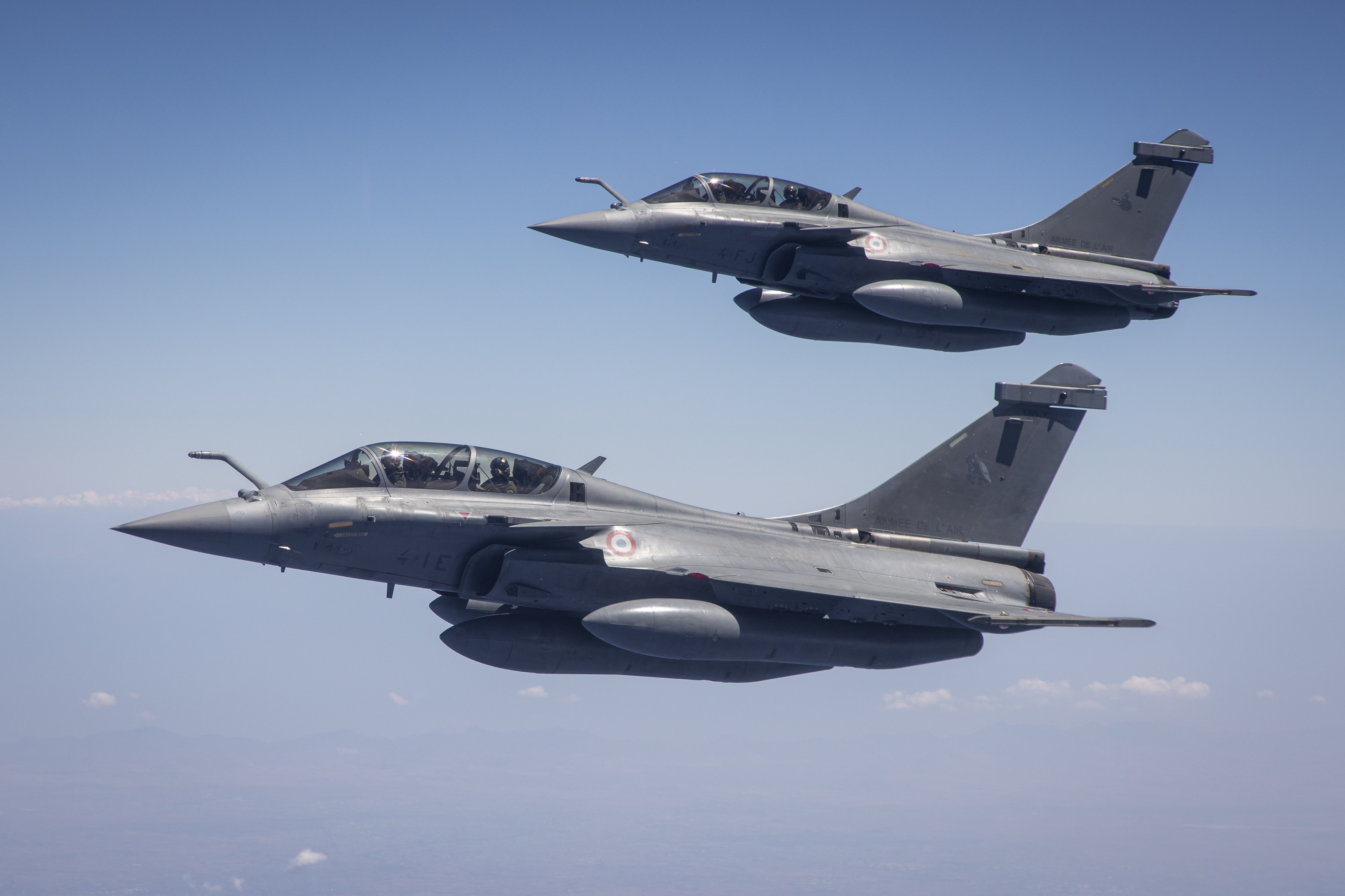 Image shows two RAF Typhoons in flight.