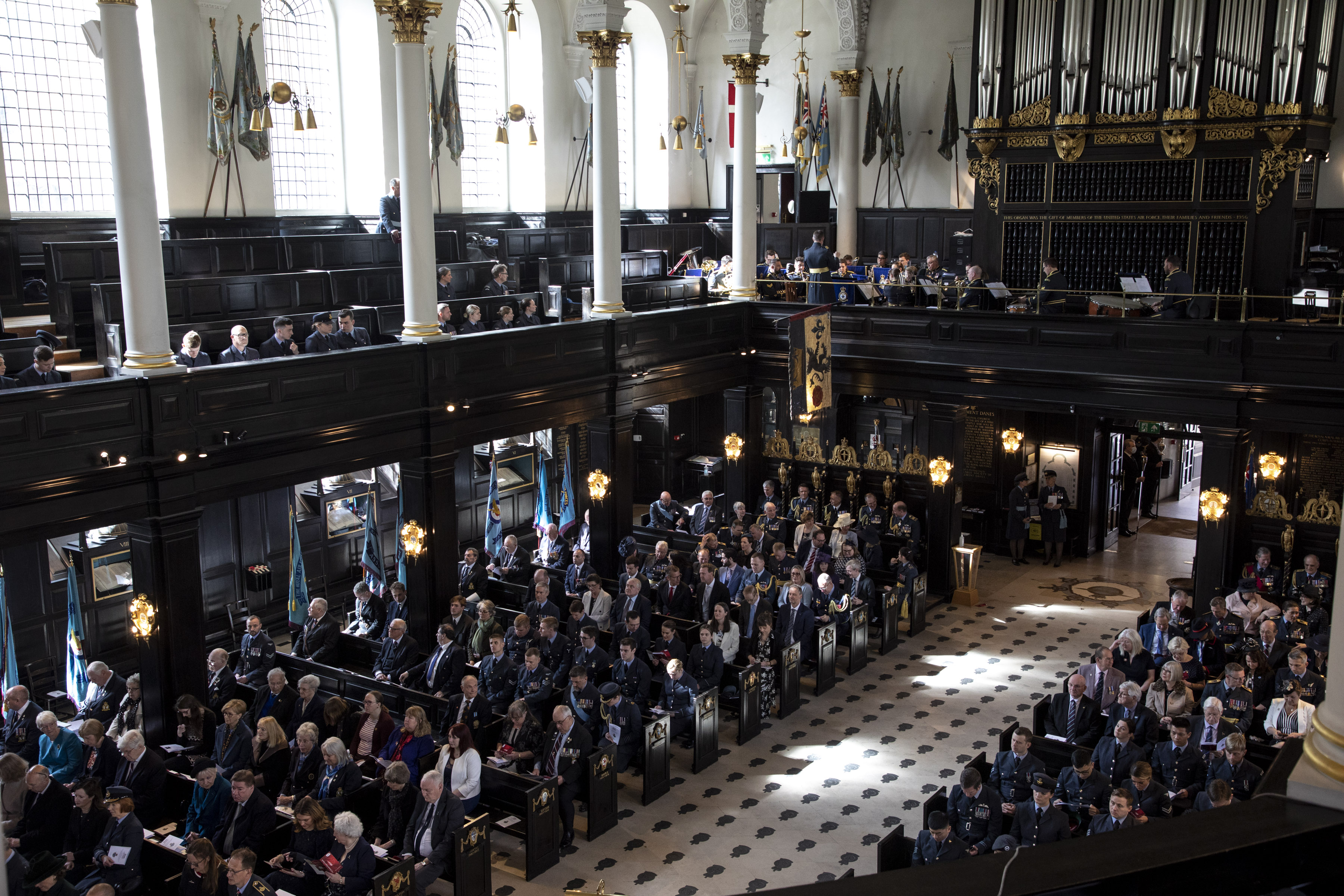 Personnel and attendance sit inside the church.