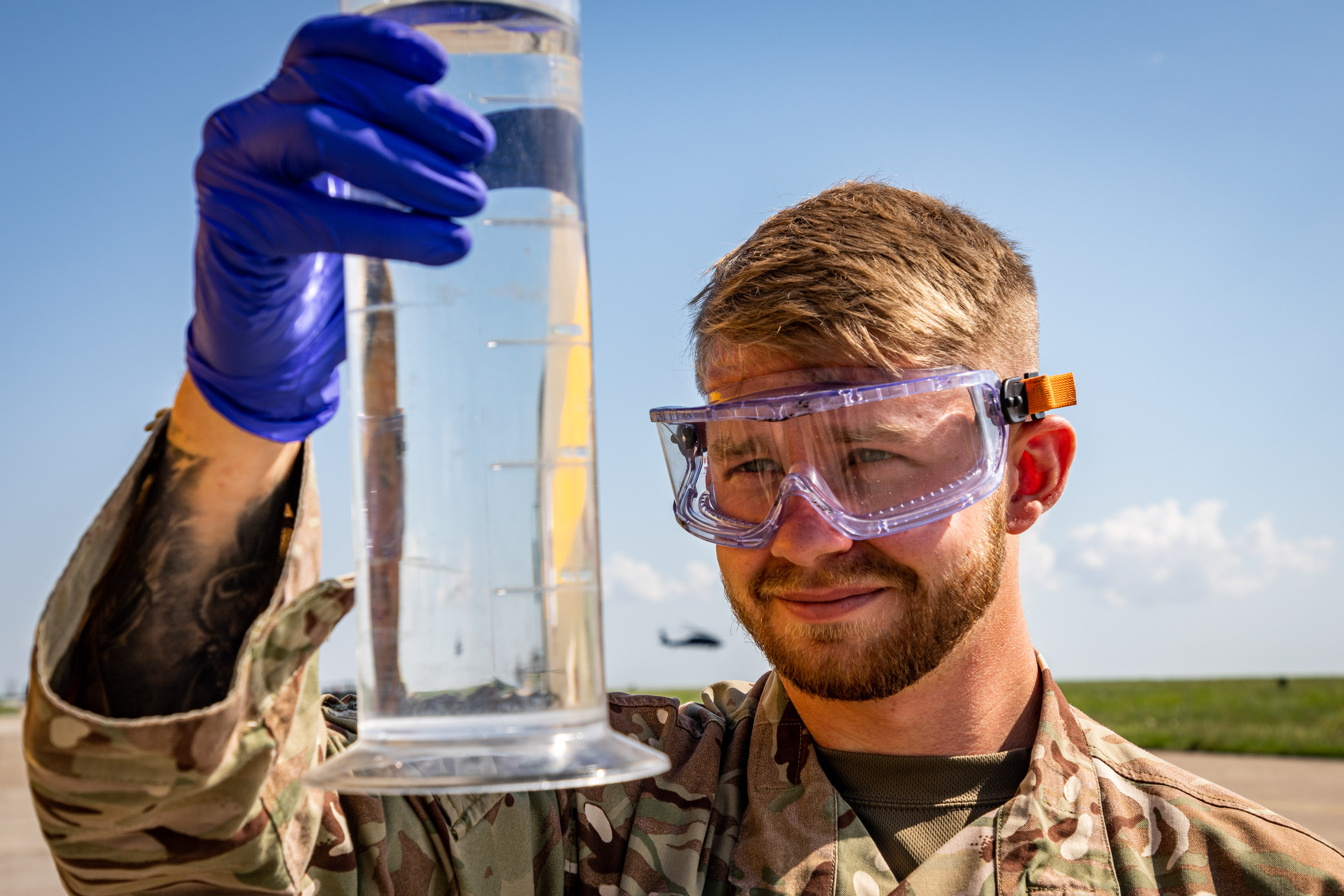 SAC Burns of 2MT Sqn checking the clarity of aviation fuel