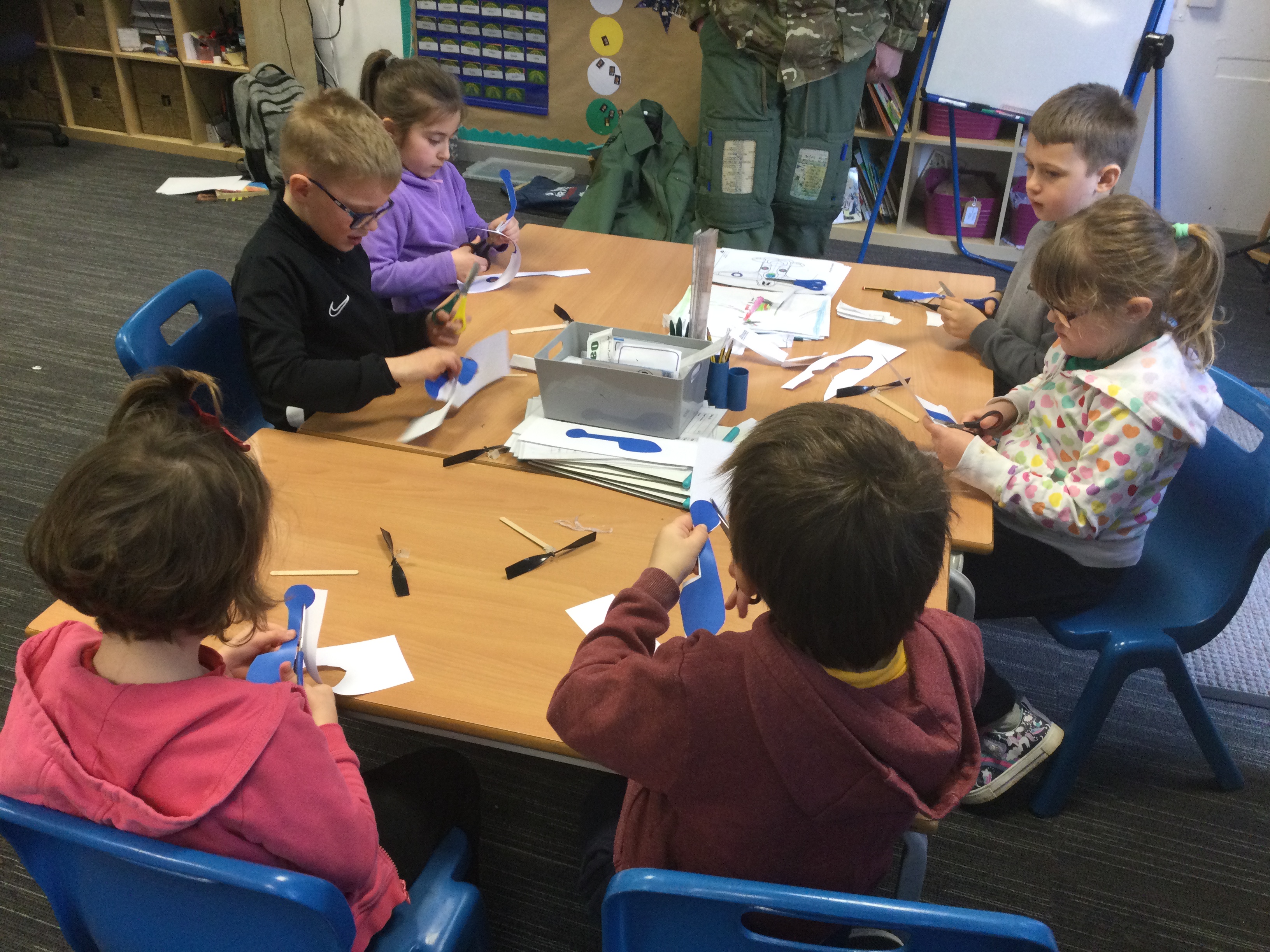 School children work on miniatures in the classroom.