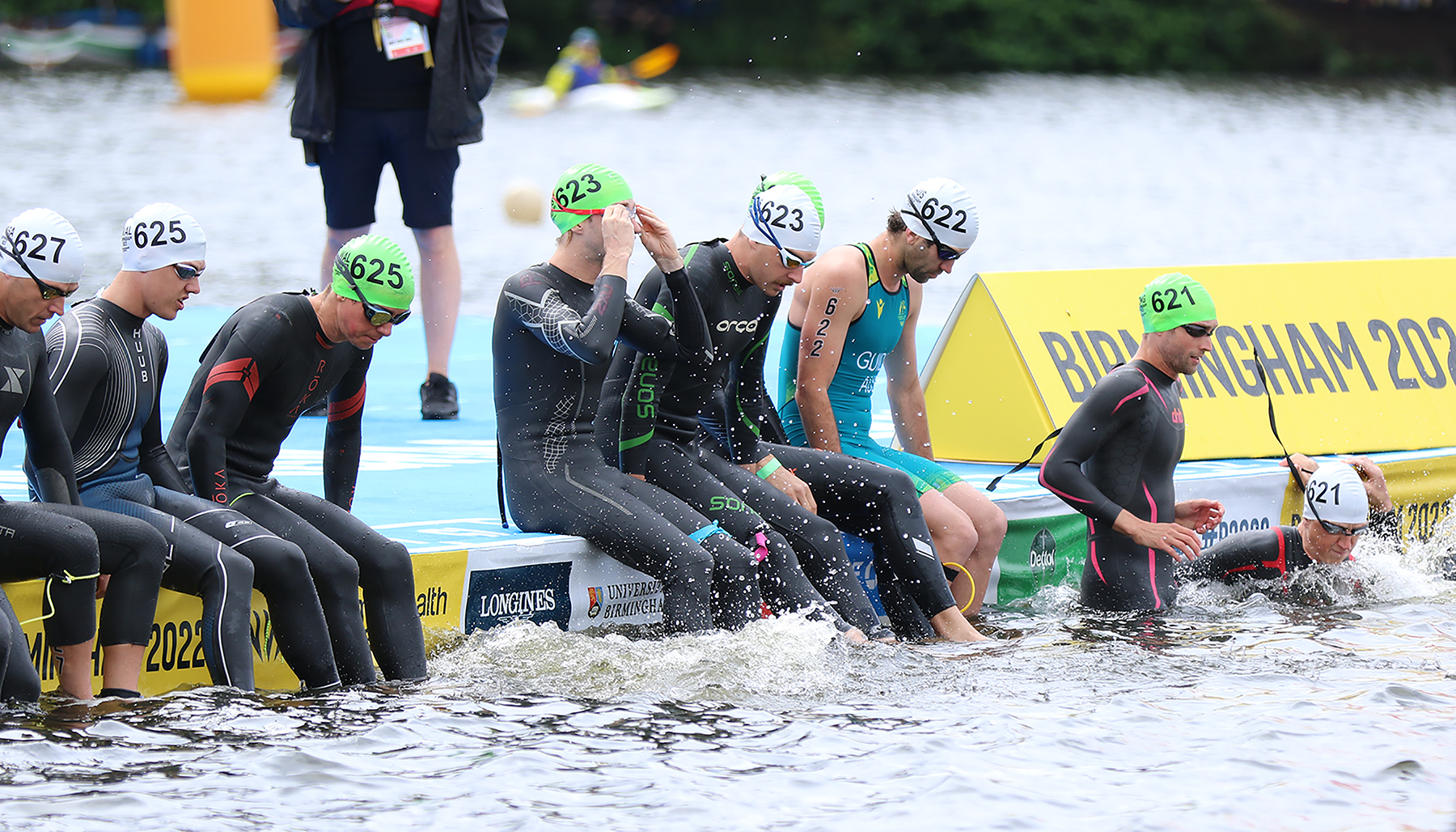 Image shows swimmers about to get into the lake.