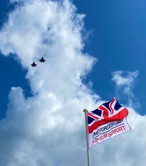 Fly past over the raised flag, of 2 F-35B aircraft