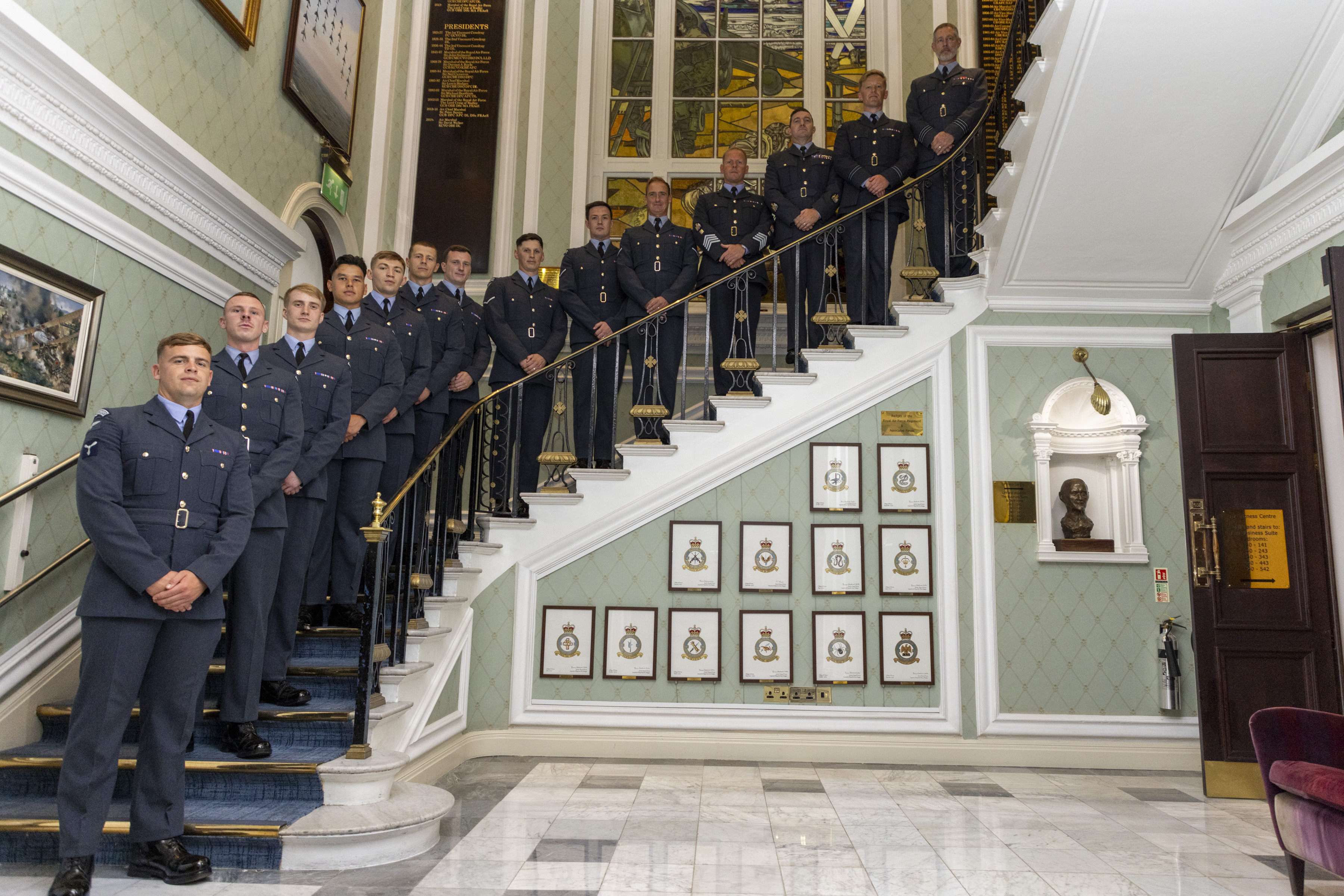 Honoured personnel on the stairs in the RAF Club