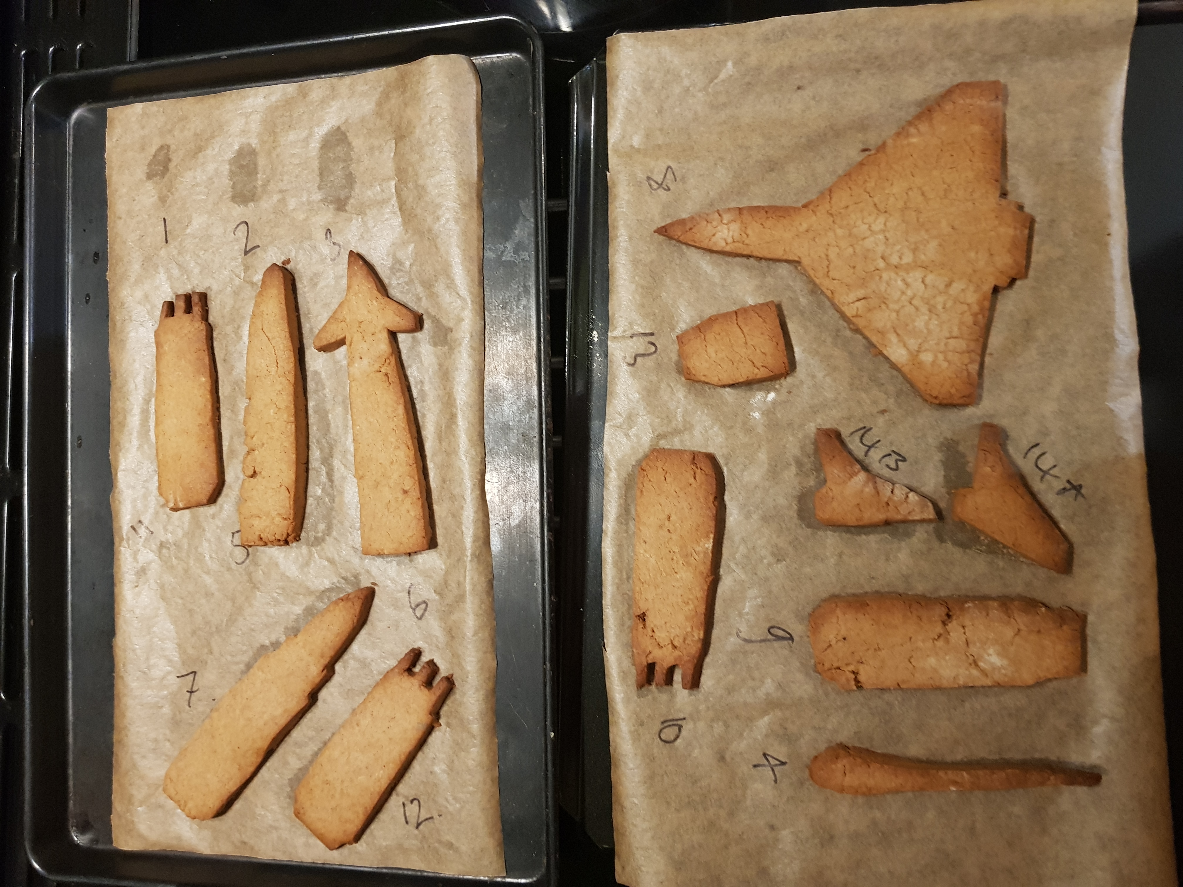 Gingerbread biscuits on the baking trays.